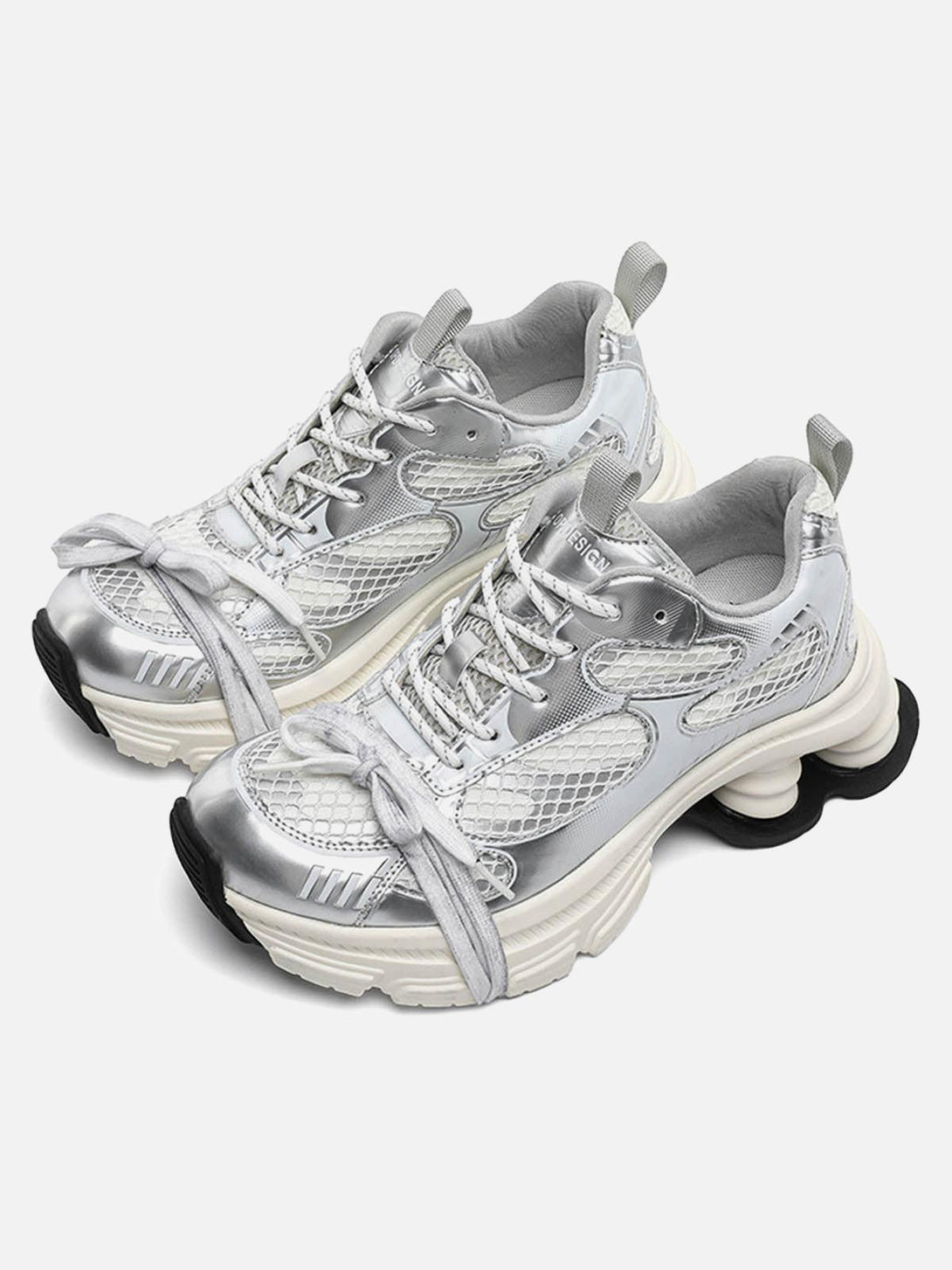TALISHKO platform sneakers in a sleek silver mesh, highlighting the chunky sole and breathable design.