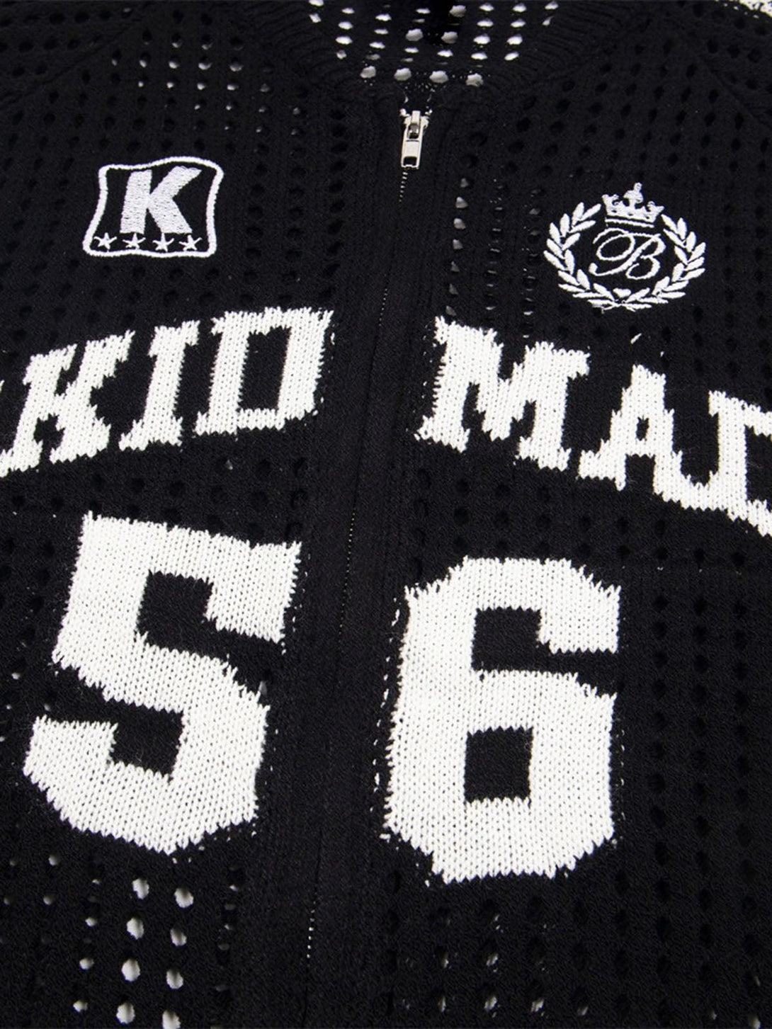 Intricate look at the black mesh fabric and bold lettering on this zip-up sports jersey by TALISHKO.