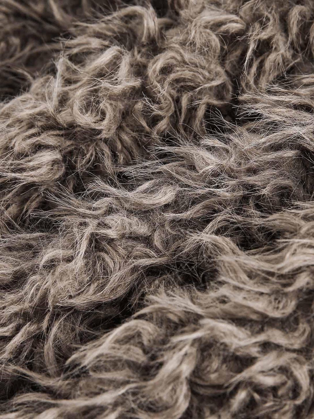 A close-up of plush faux fur texture, crafted by TALISHKO, highlighting its luxurious feel.