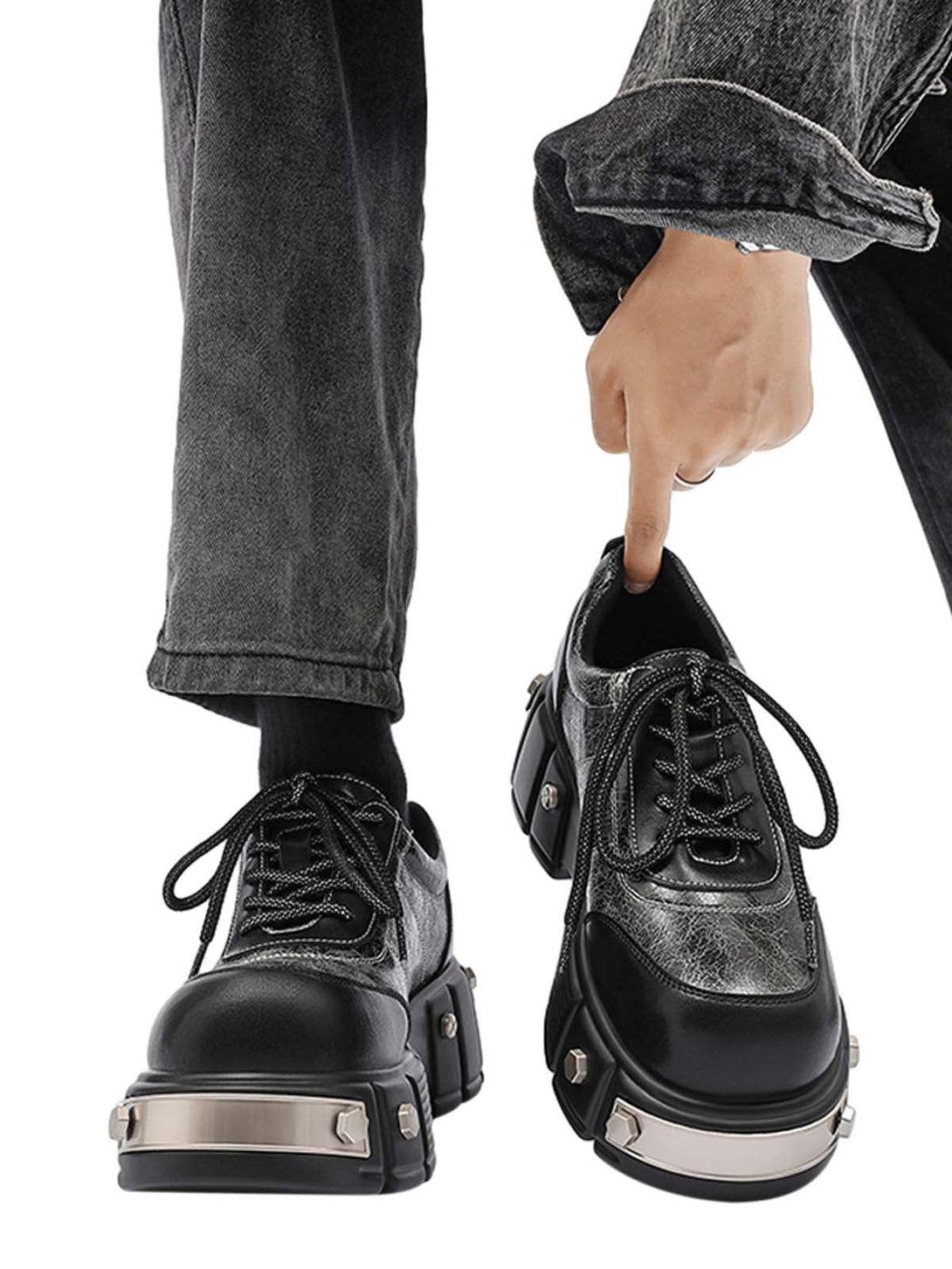 TALISHKO chunky leather shoes with metal plates, highlighted in a bold streetwear look.
