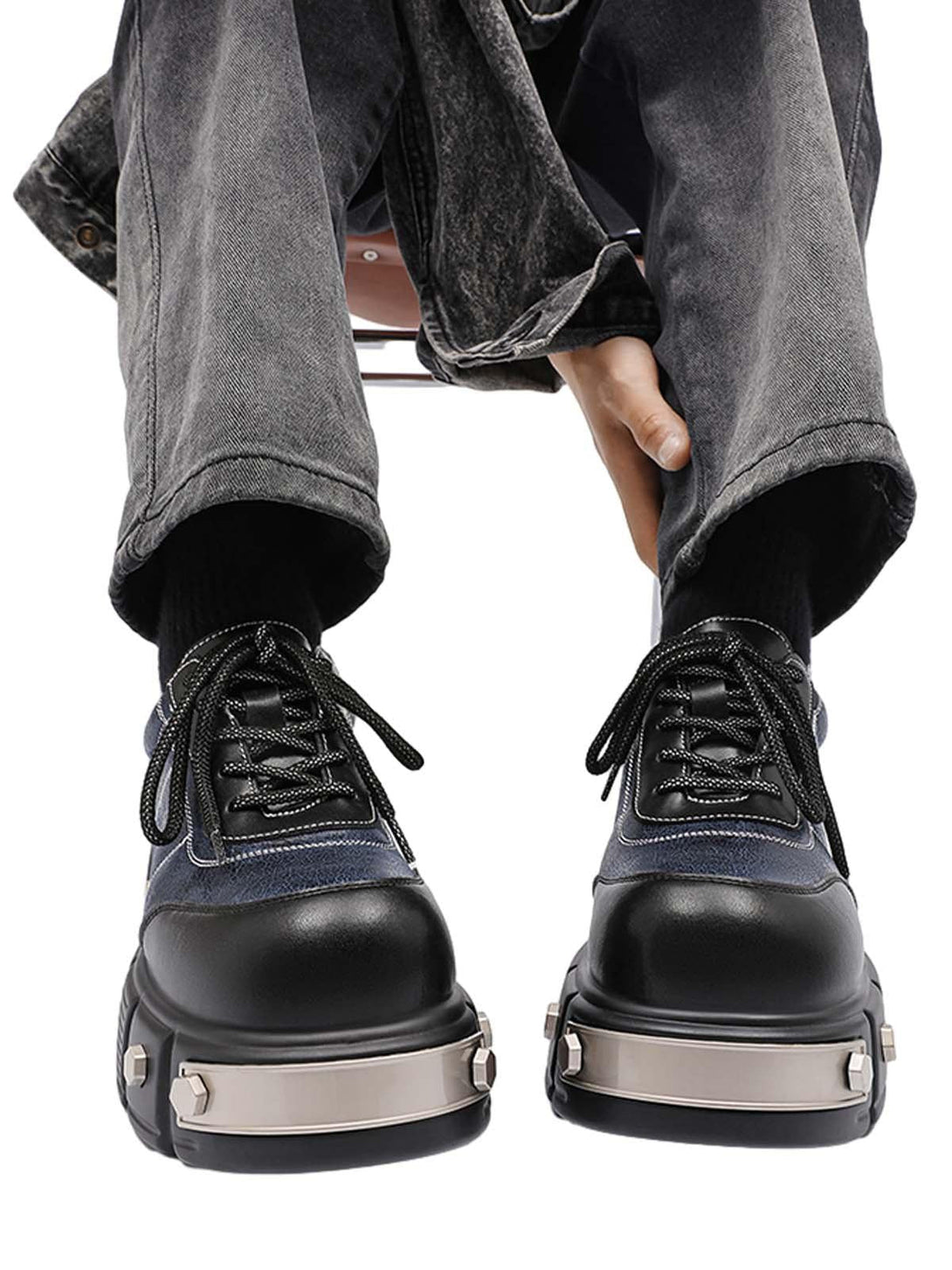 TALISHKO chunky leather shoes with metal plates, styled with gray denim for a bold look.