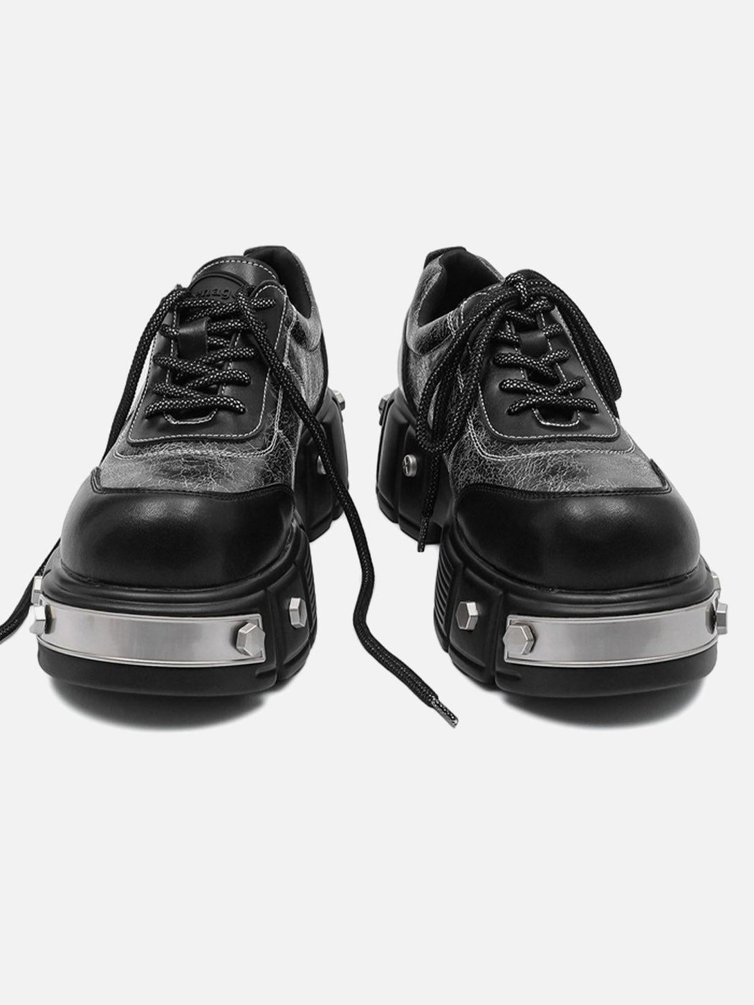 Chunky leather shoes by TALISHKO with metal plates, offering a futuristic and bold look.