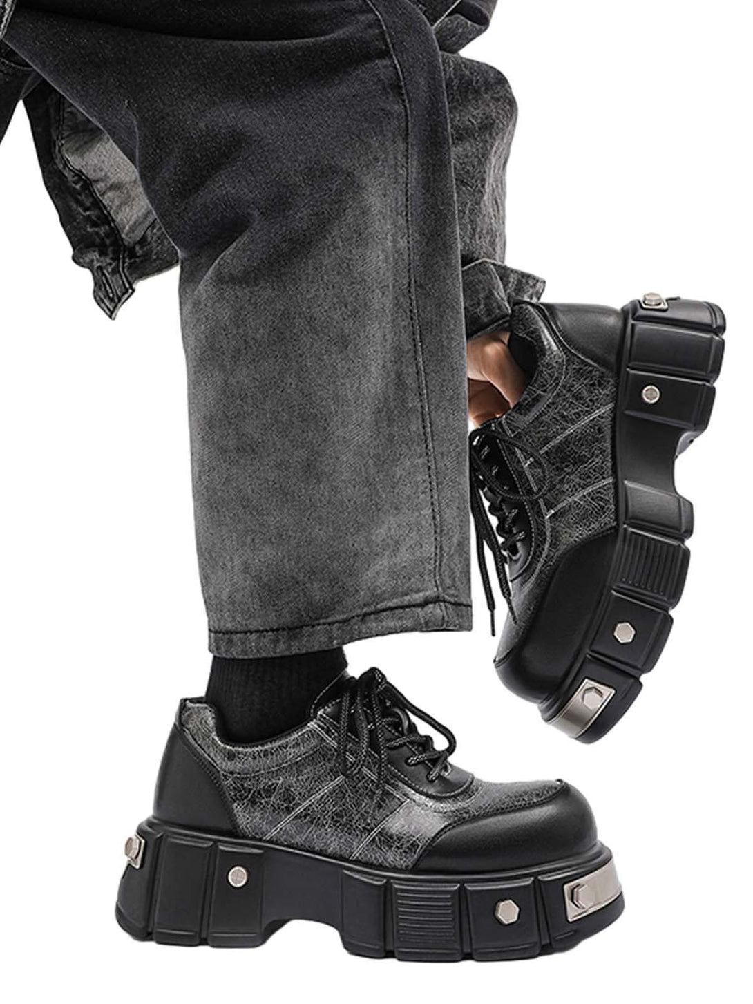 TALISHKO chunky leather shoes with metal accents, paired with gray denim for a bold vibe.