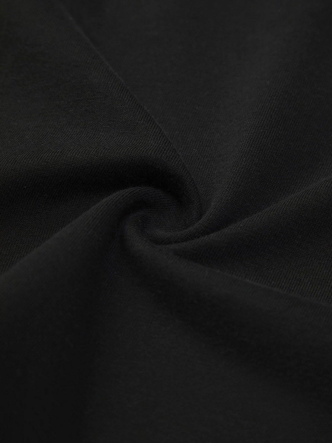 Zoomed-in fabric texture of a TALISHKO street rap T-shirt, highlighting its smooth, dark material.