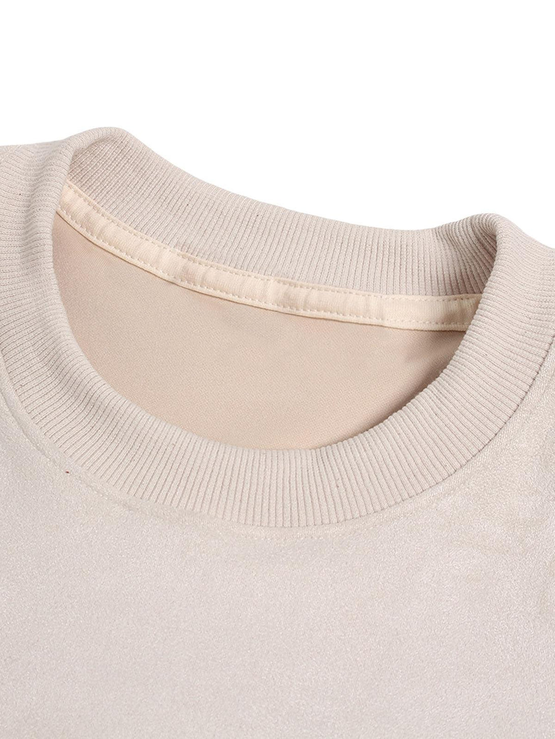 A detailed view of the TALISHKO suede crew neck T-shirt's ribbed collar and luxurious texture.