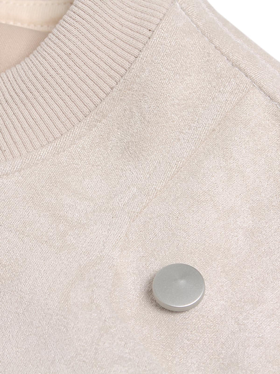 Detailed fabric and stitching of TALISHKO's suede crew neck T-shirt with metallic accent.