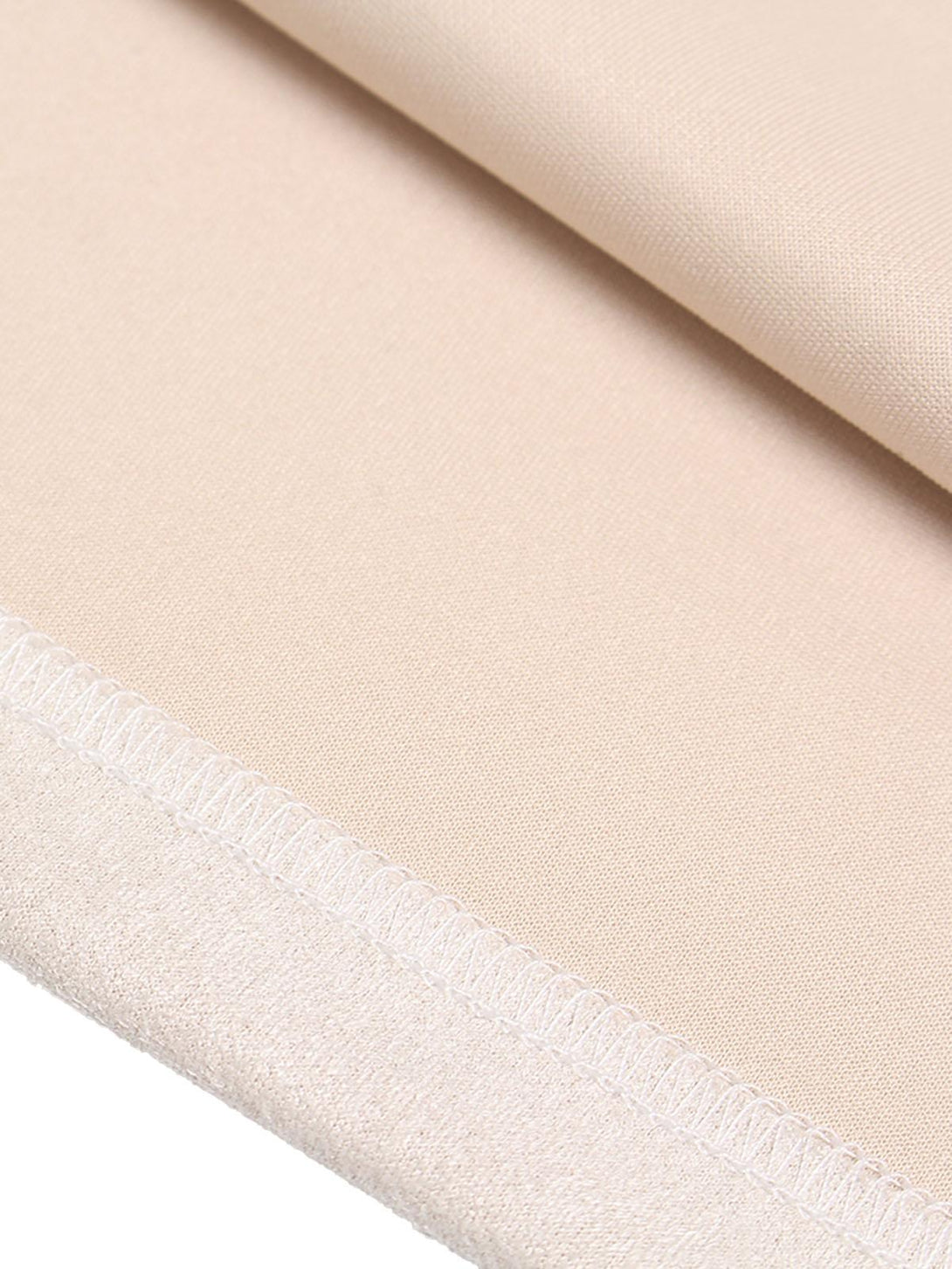 Detailed fabric and stitching of TALISHKO's crew neck T-shirt in beige with a metallic accent.