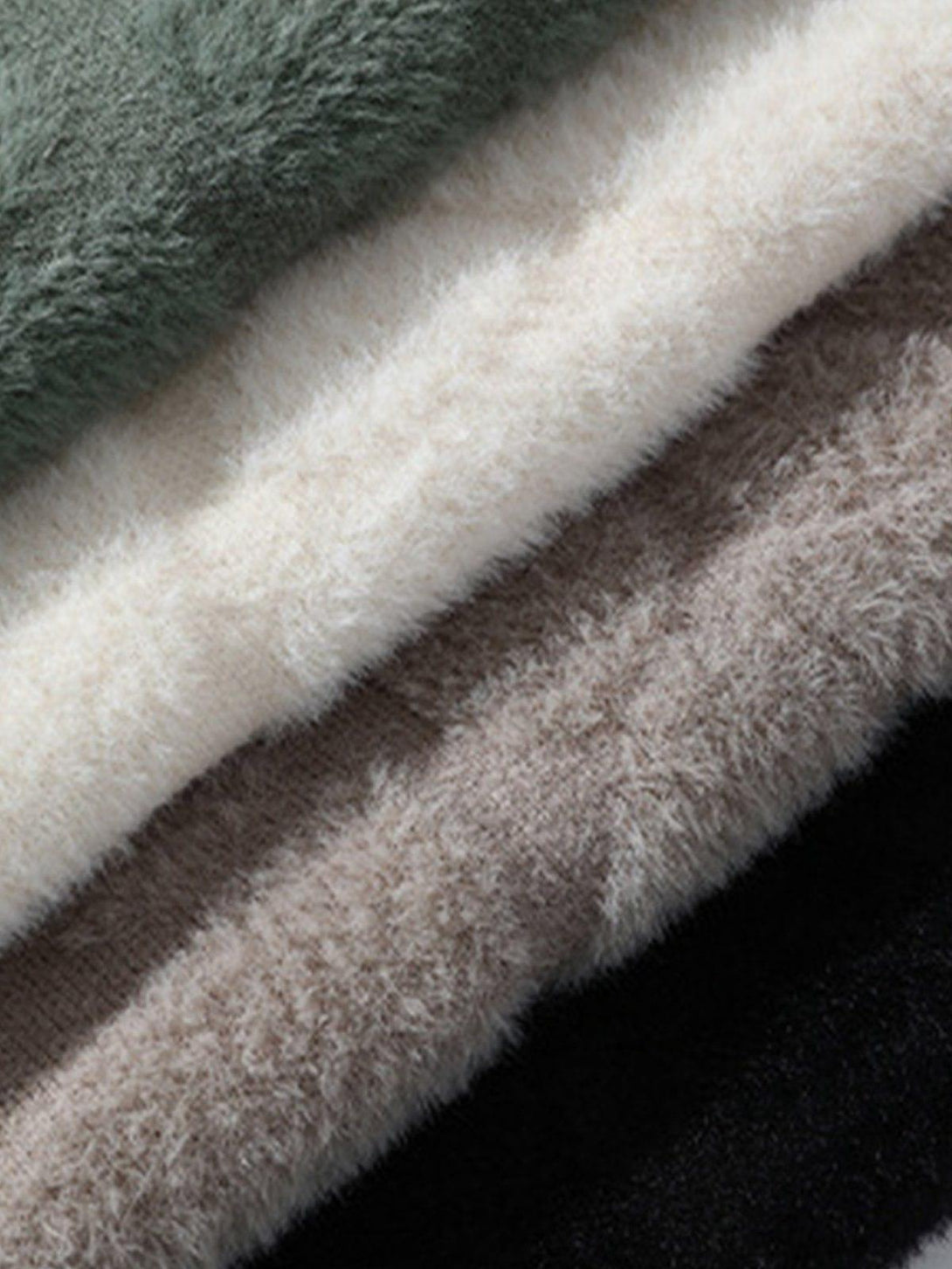 A detailed view of mink fleece fabric in multiple colors by TALISHKO, highlighting its soft texture.