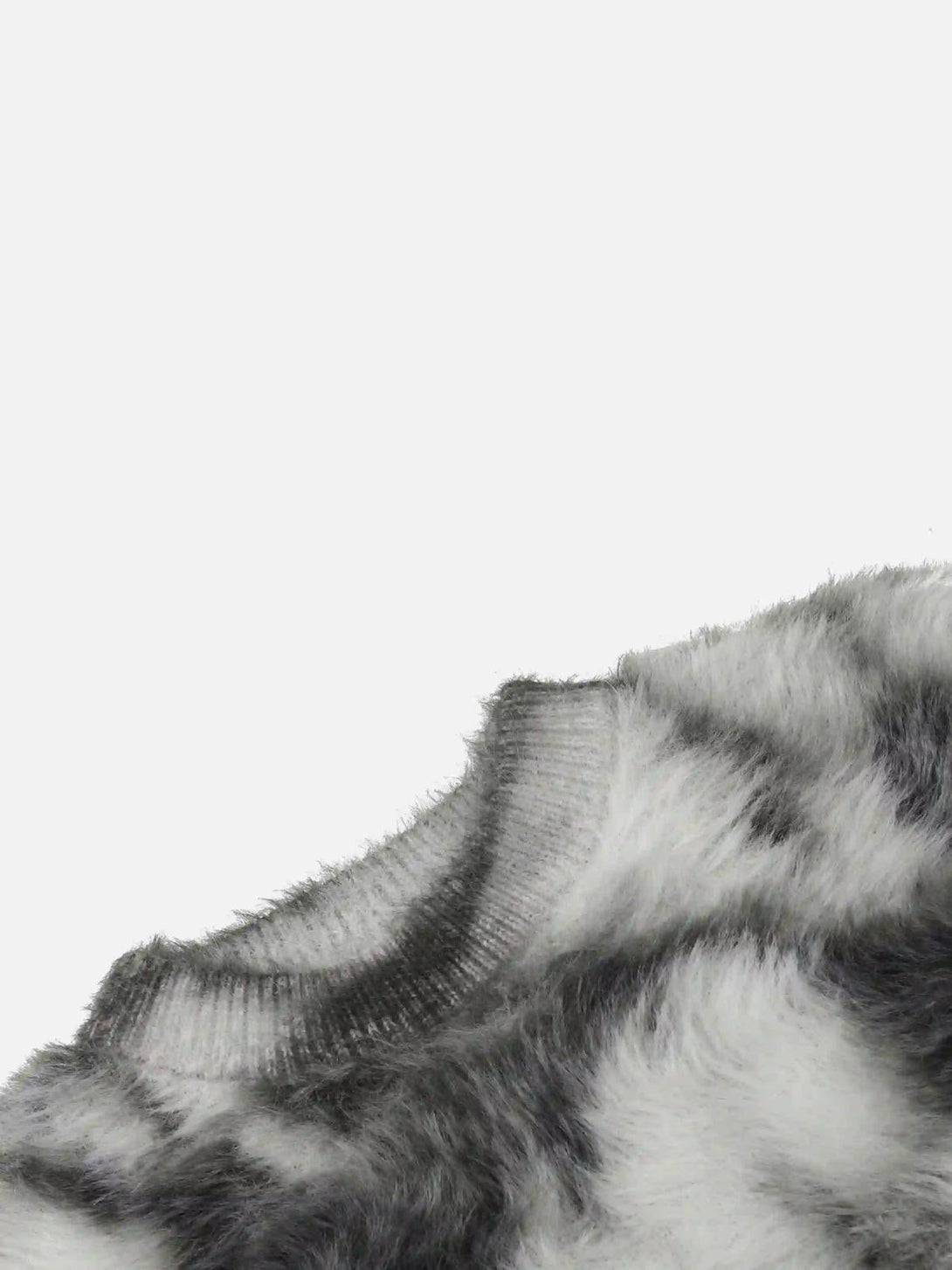 A tight crop highlighting TALISHKO's mohair sweater texture in black and gray tie-dye.