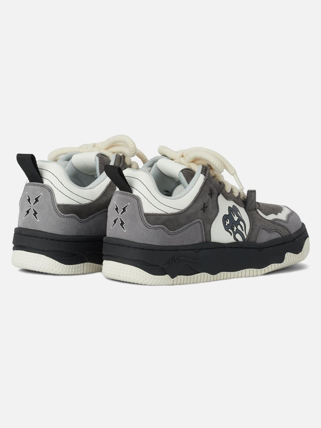 Back view of TALISHKO sneakers showcasing monochrome design with striking heel details.