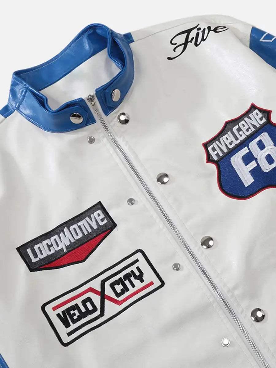 A detailed view of TALISHKO's racing jacket, showcasing unique patches and blue accents.