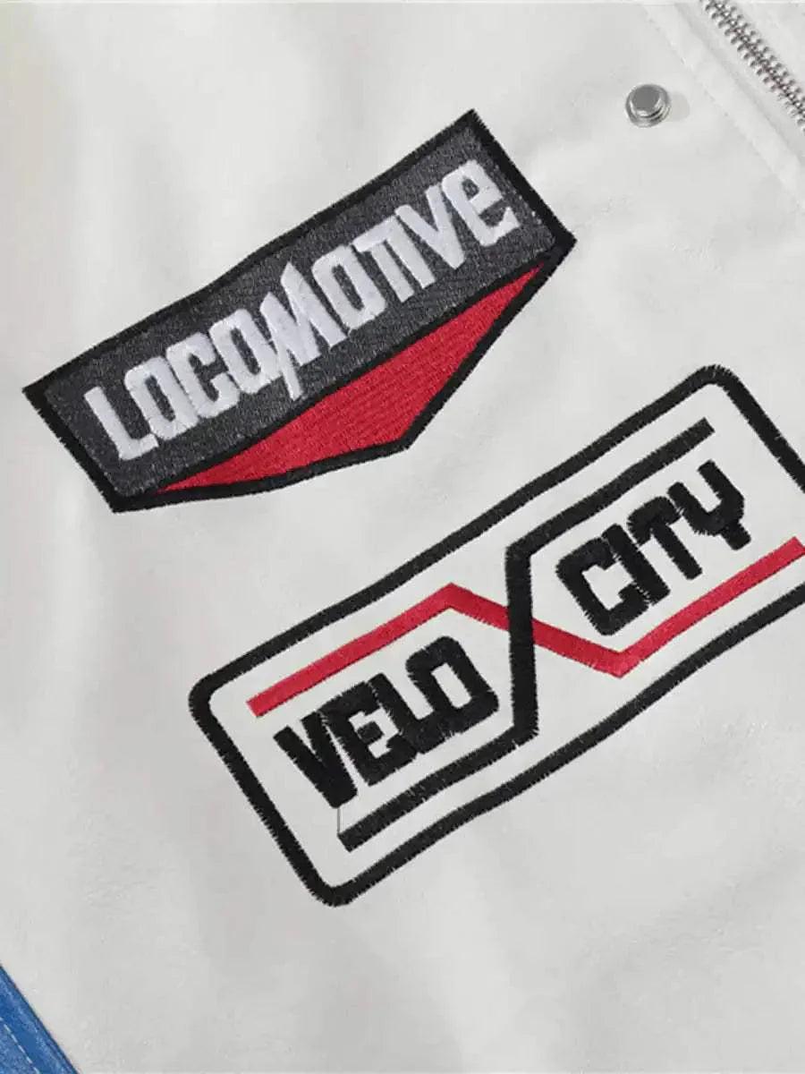 Intricate look at TALISHKO's racing jacket, highlighting distinctive patches and stitching.