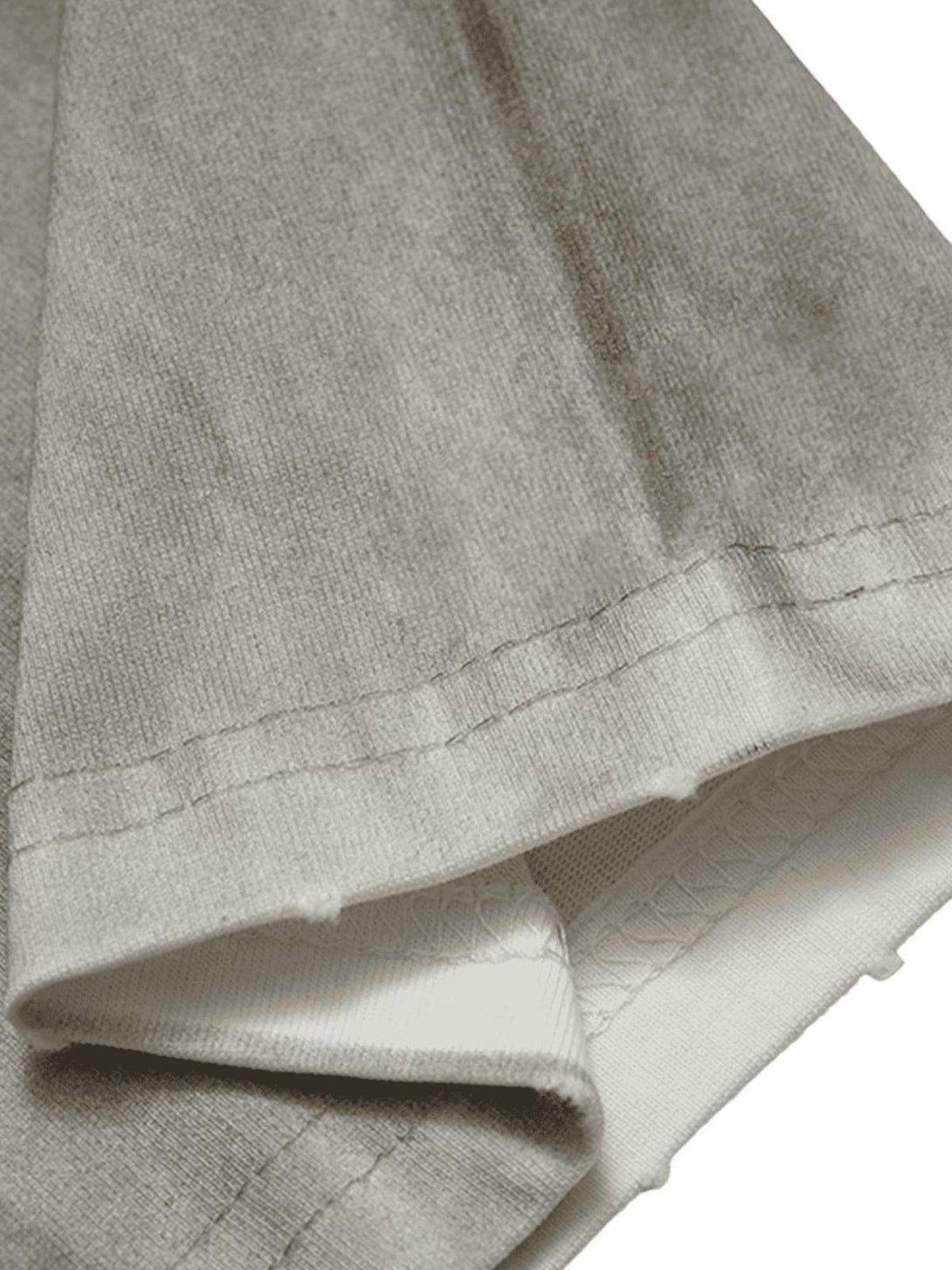 A close-up view of the fabric texture on a TALISHKO street rap T-shirt, highlighting the stitching.