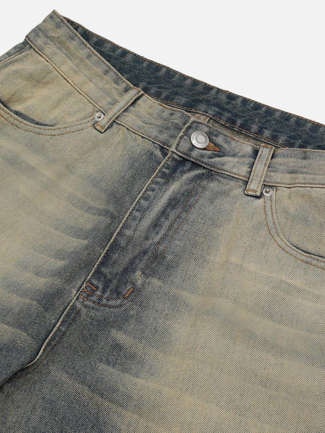 Detailed fabric and stitching of mud dyeing jeans by TALISHKO, showcasing unique texture.