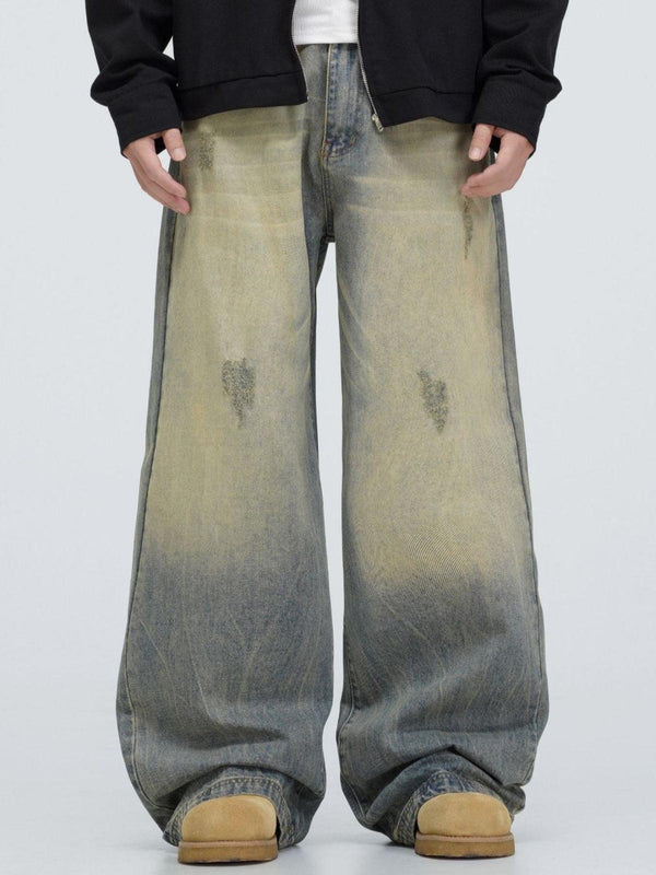 Wide-leg mud dyeing jeans by TALISHKO, showcasing a distinctive distressed style.