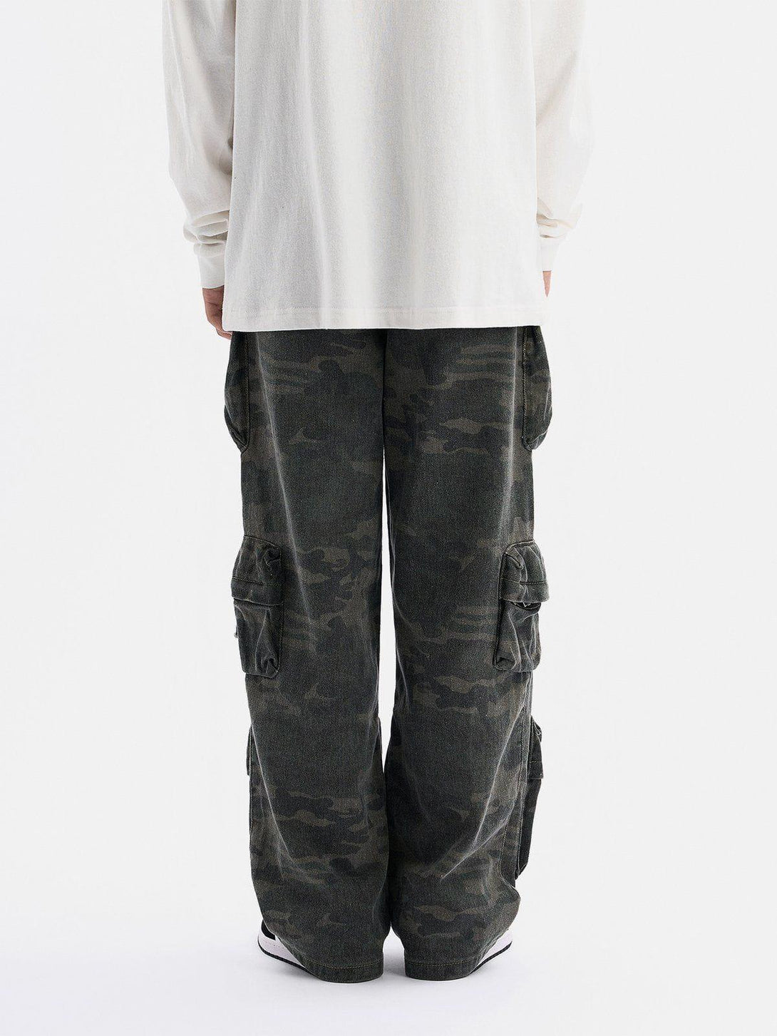 Back view of TALISHKO camouflage cargo pants with multiple pockets, highlighting a casual style.