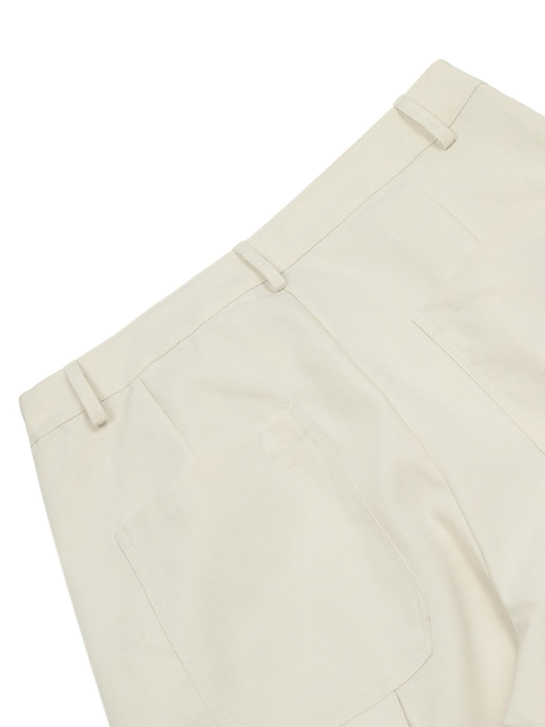 A detailed look at the back of beige multi-pocket cargo pants by TALISHKO, highlighting pockets.
