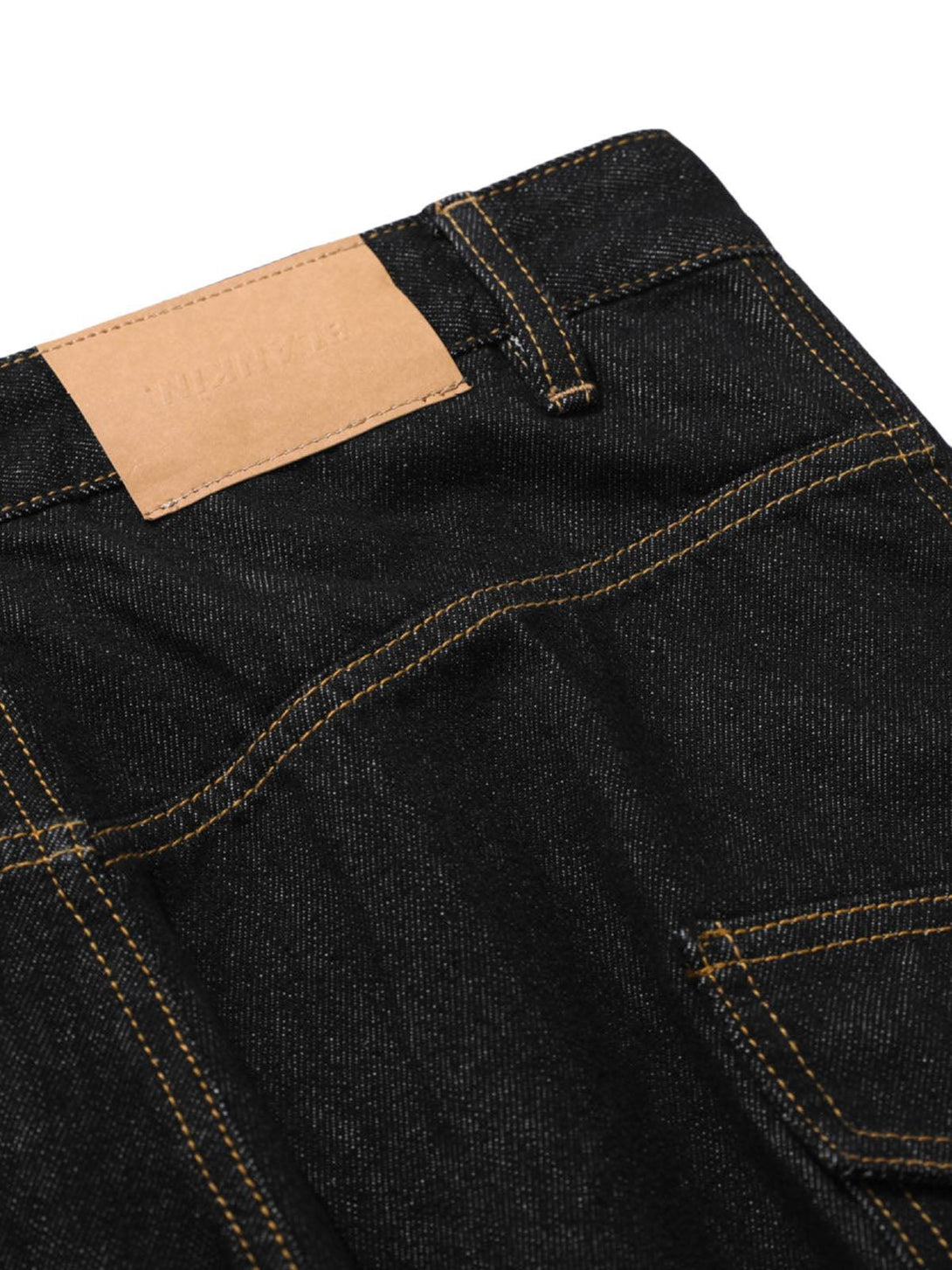 Detailed view of TALISHKO's barrel cargo jeans, highlighting stitching and pocket design.