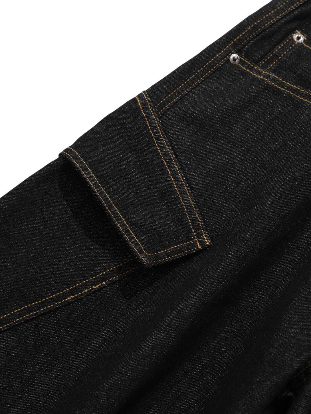 Intricate look at TALISHKO's deconstructed black cargo jeans, highlighting pocket detail.