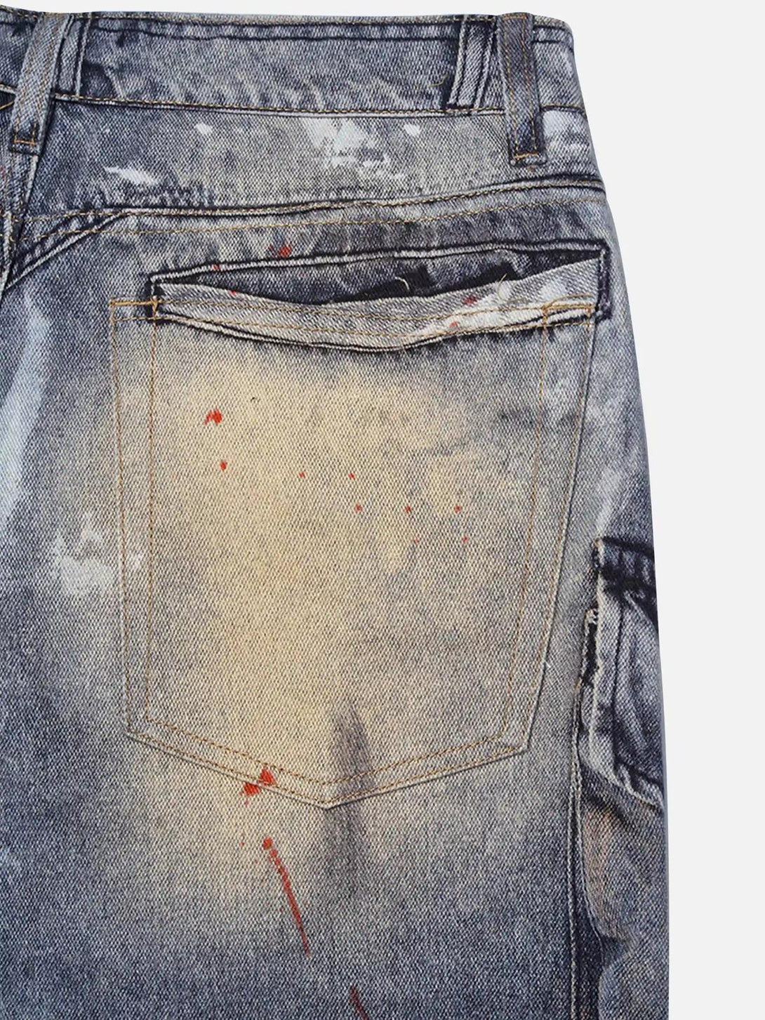 Focusing on the back pocket of TALISHKO's multi-pocket jeans, showcasing distressed details.