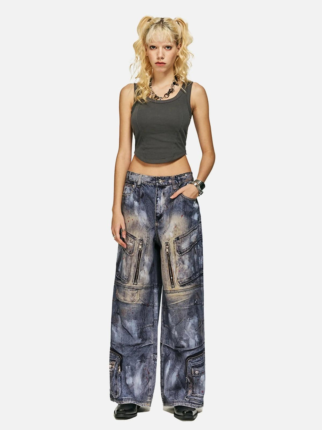 TALISHKO multi-pocket dirty overalls jeans styled with a dark crop top for a bold look.