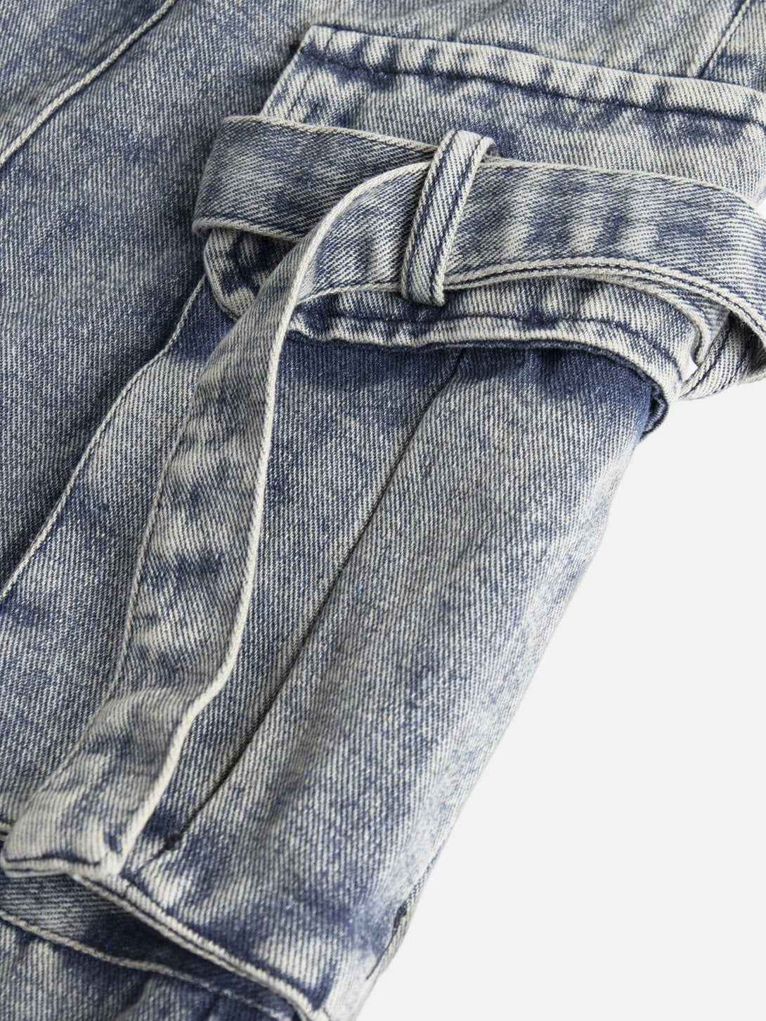 A detailed view of TALISHKO's drawstring jorts, highlighting intricate denim texture.