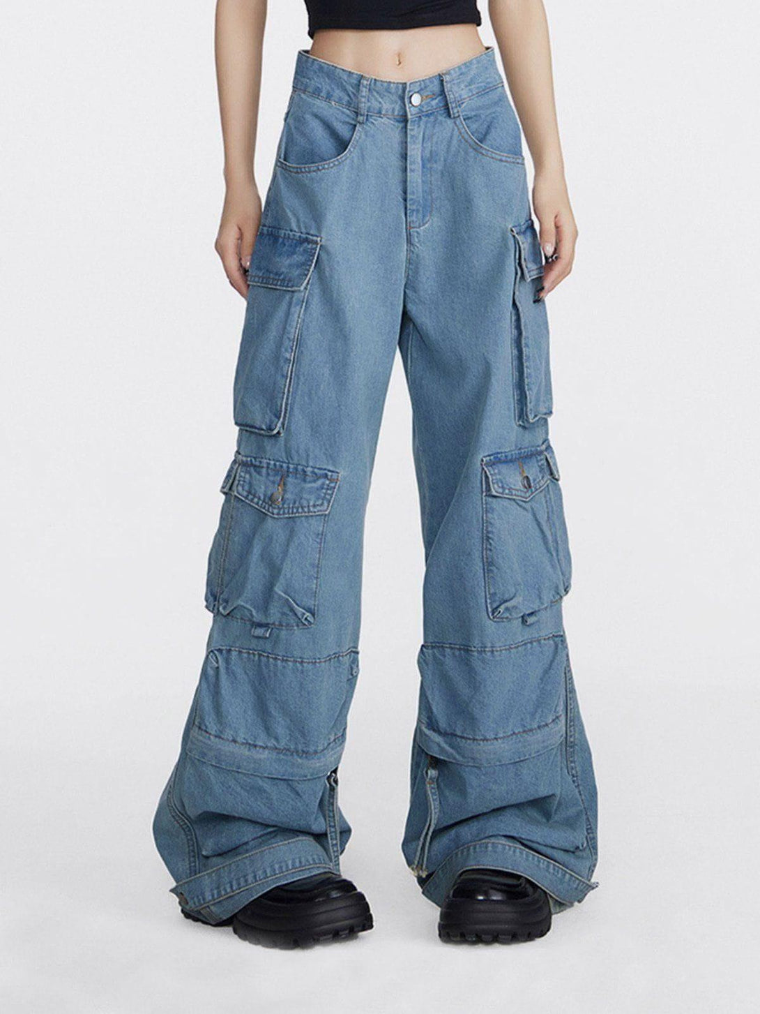 Model wearing TALISHKO loose cargo jeans with multiple pockets, highlighting a trendy street style.