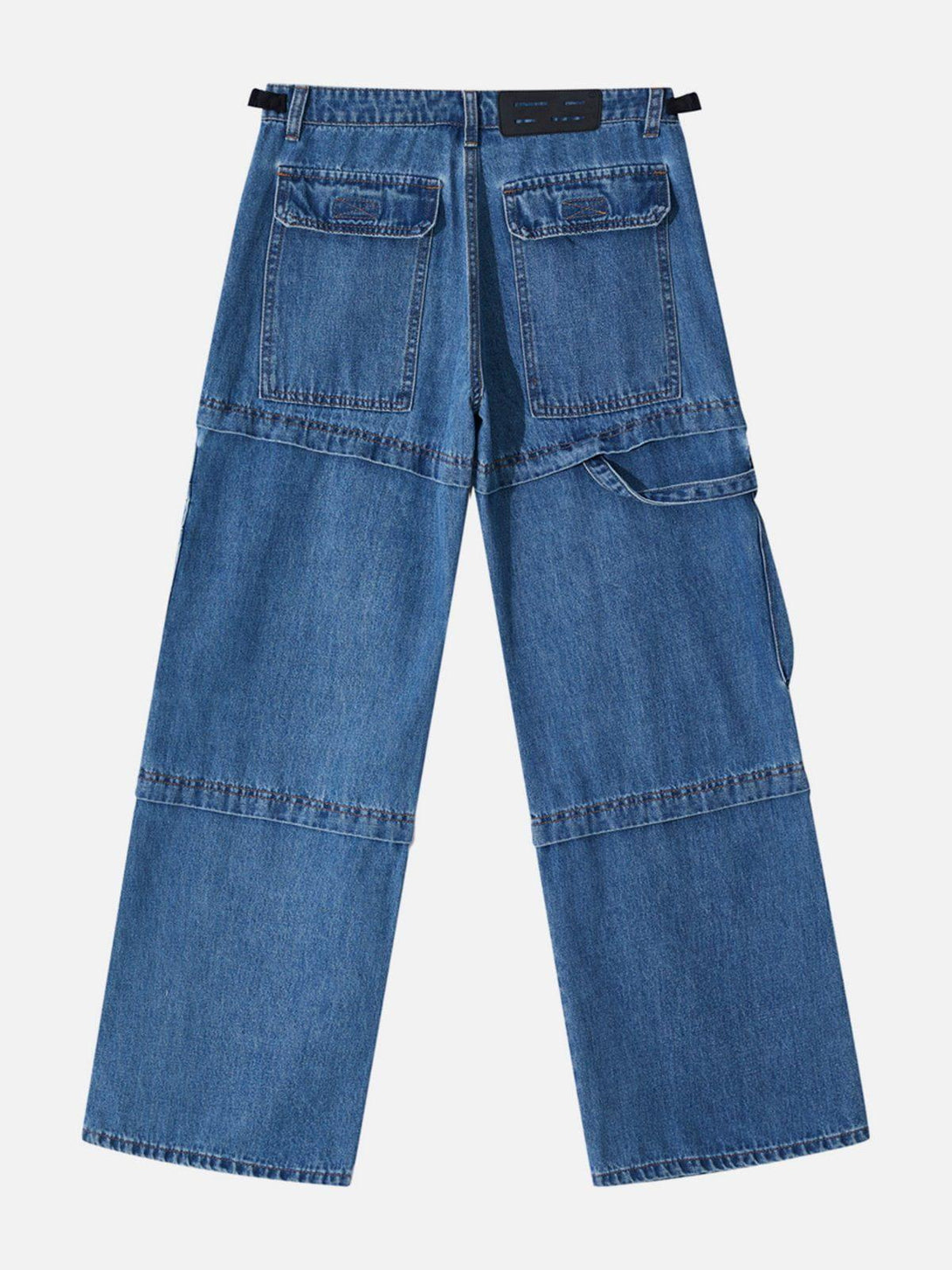 Back view of TALISHKO patchwork straight-leg jeans showcasing multiple pockets in denim.