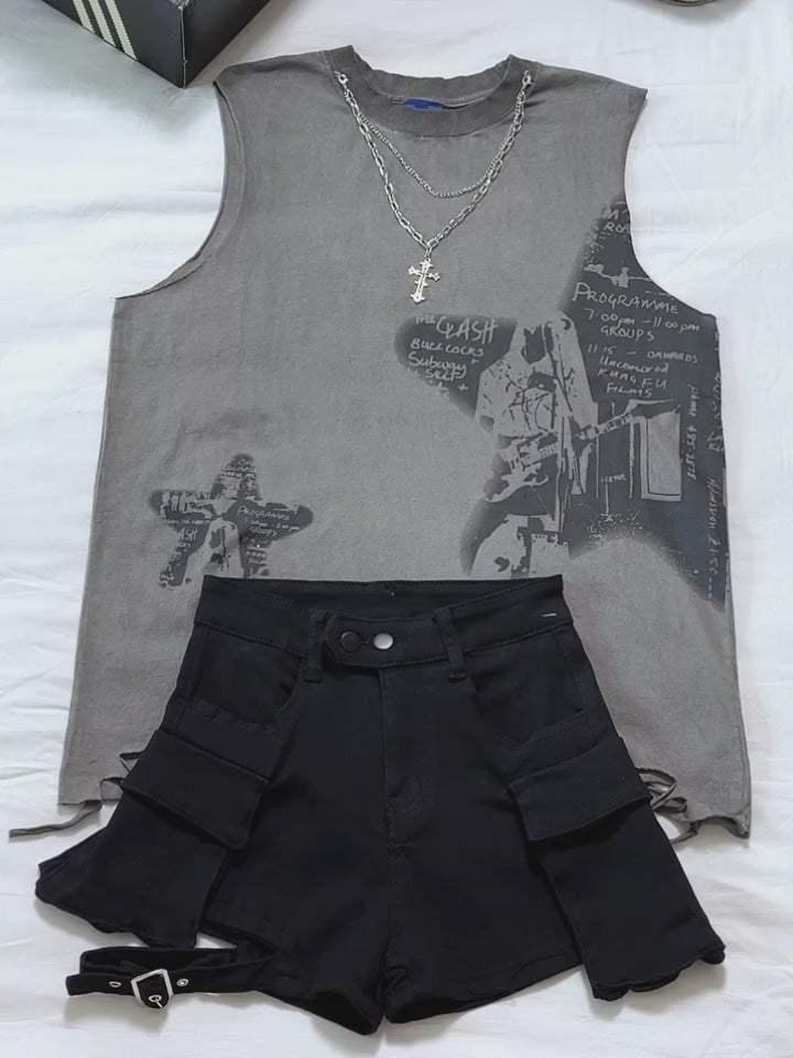 Gray sleeveless graphic tee paired with TALISHKO black multi-pocket shorts, accented by a chain necklace.