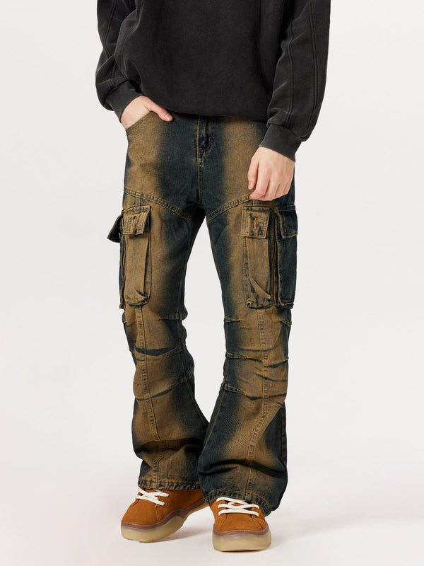 Model wearing multi-pocket washed cargo jeans by TALISHKO, paired with casual sneakers.