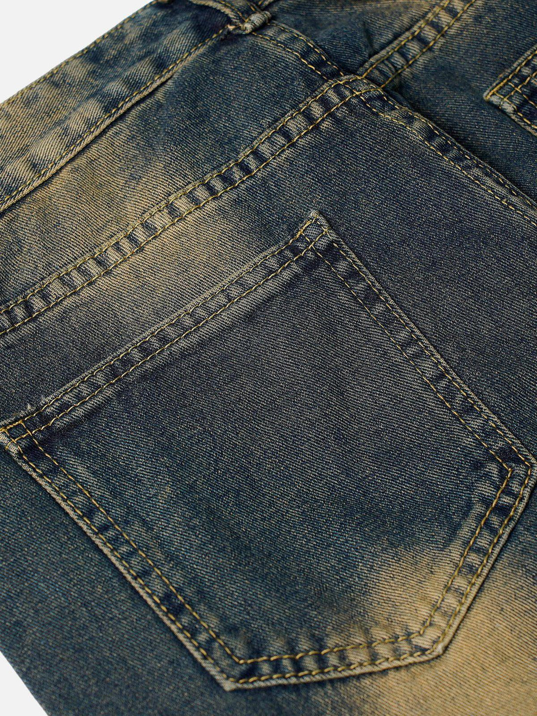A detailed view of TALISHKO cargo jeans, emphasizing the washed denim texture and stitching.