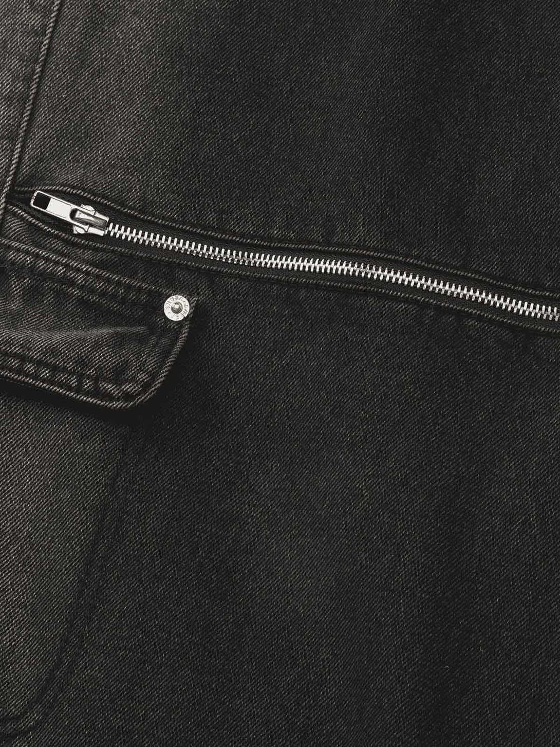 Intricate look at TALISHKO's hip-hop jeans, highlighting the sleek zipper and pocket design.