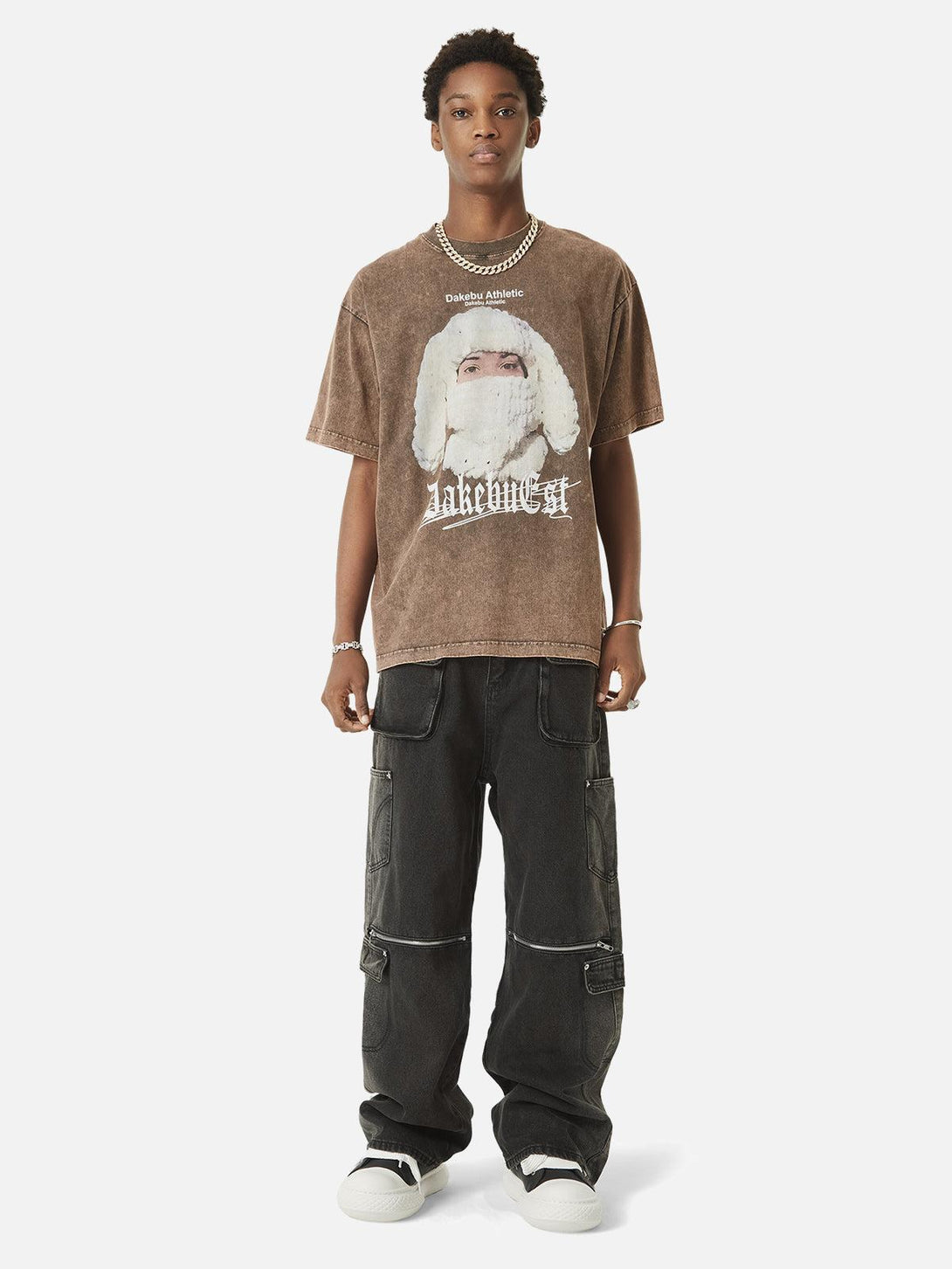 Model in TALISHKO washed hip-hop jeans with multi-pocket zippers, paired with a graphic tee.