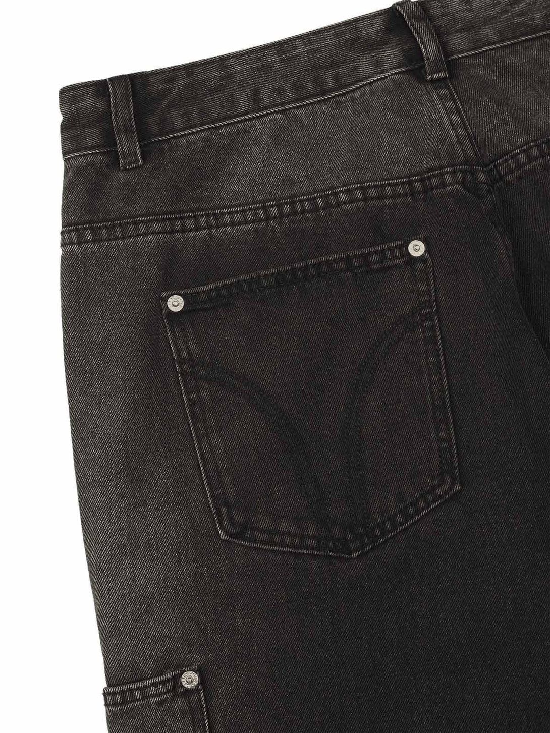 A detailed view of TALISHKO's hip-hop jeans, focusing on back pocket stitching and texture.