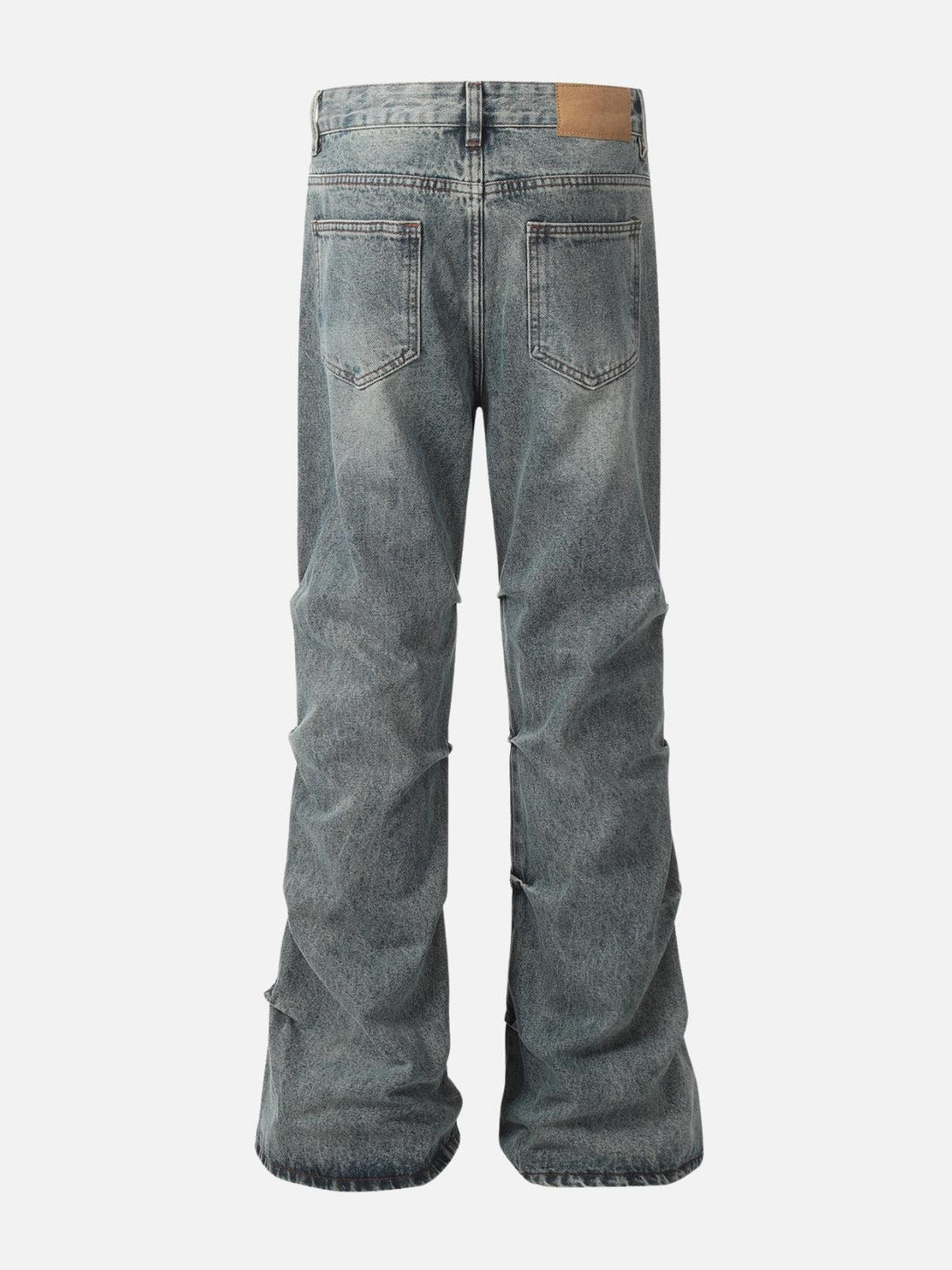 Back view of wrinkle-washed jeans by TALISHKO, highlighting relaxed fit and vintage appeal.