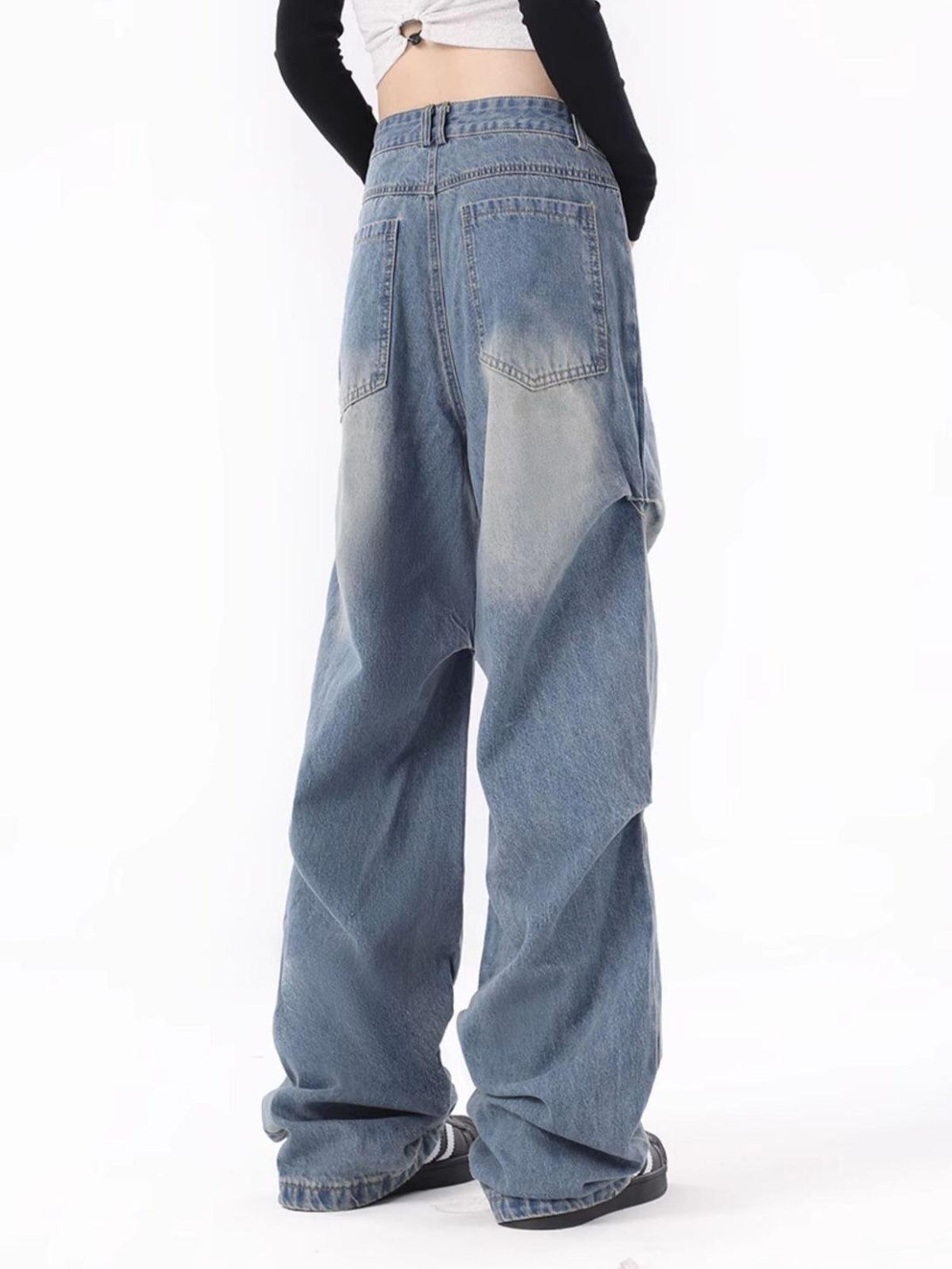 Back view of TALISHKO's wrinkle jeans, featuring a relaxed fit and stylish streetwear vibe.