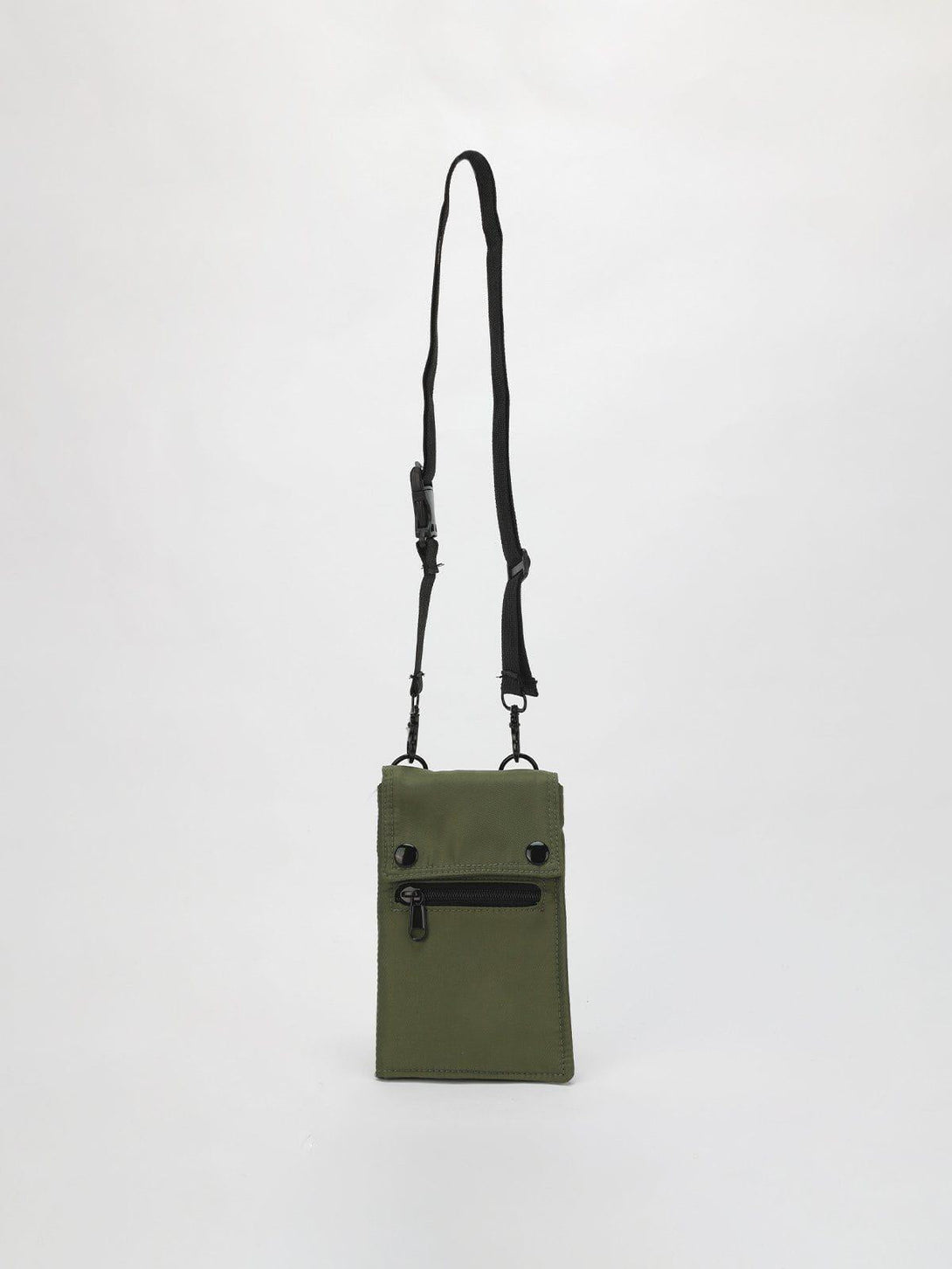 Green multipurpose crossbody bag by TALISHKO with adjustable strap and front zipper pocket.