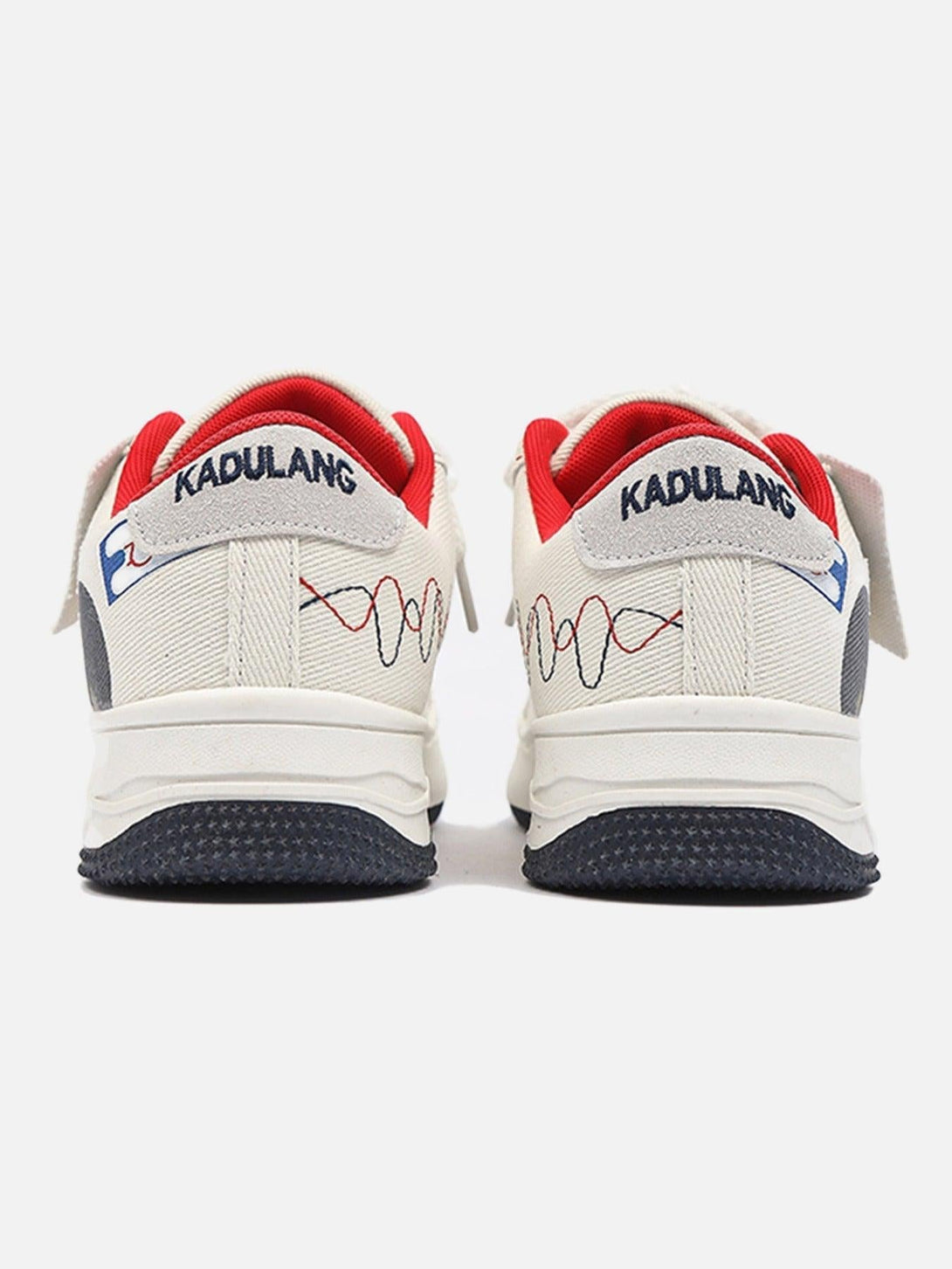 Back view of TALISHKO canvas shoes with graphic accents and red detailing, highlighting casual flair.