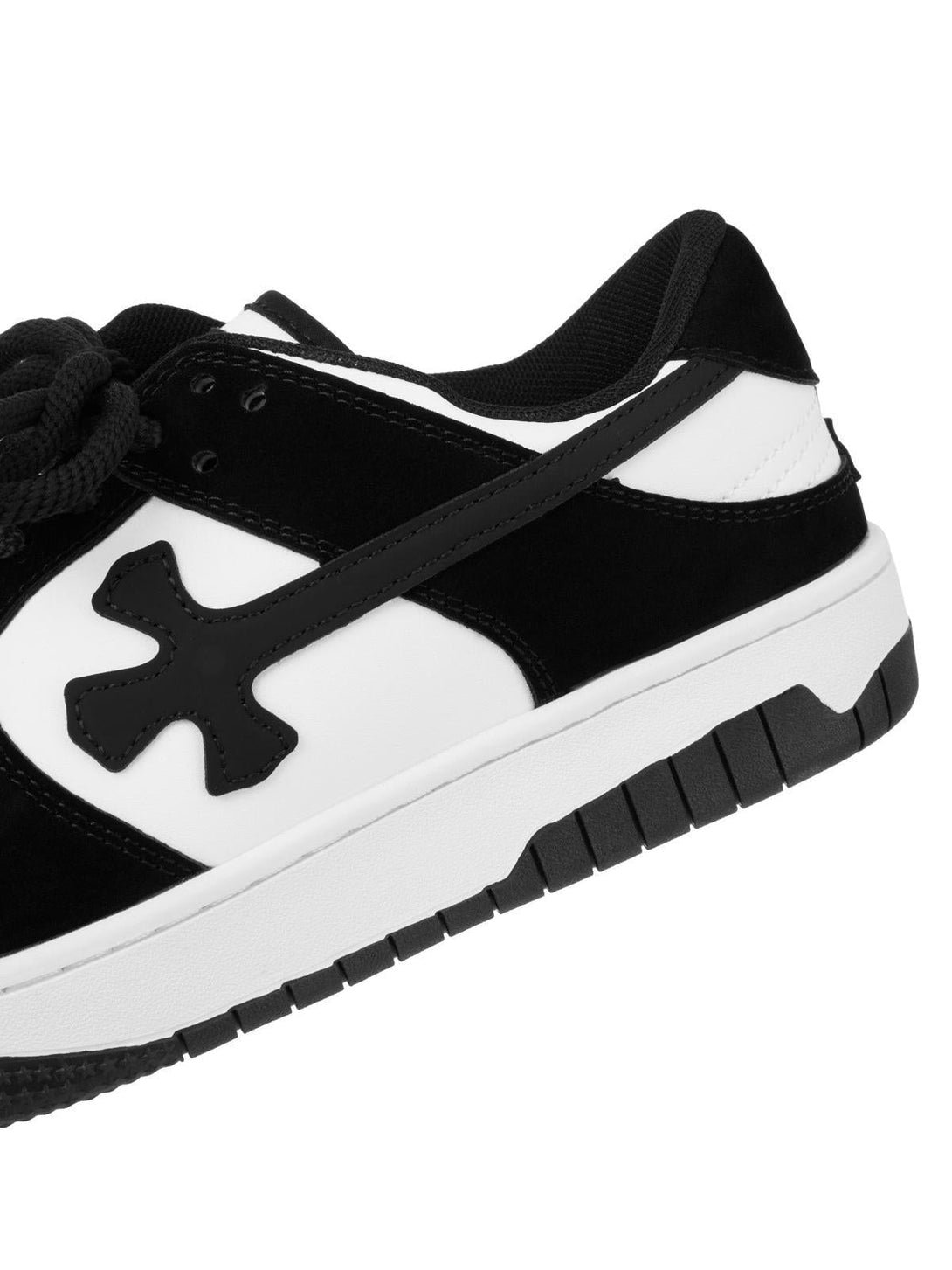 Close-up of TALISHKO's black and white casual shoe, showcasing its distinctive side pattern.