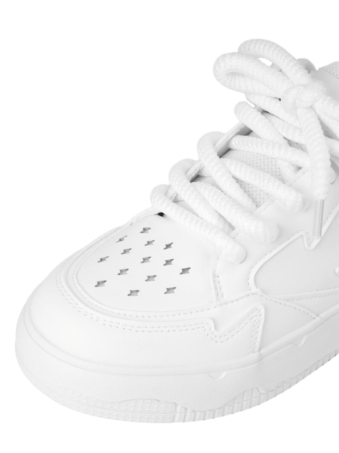 Close-up of white TALISHKO retro board shoes, highlighting perforated details and laces.