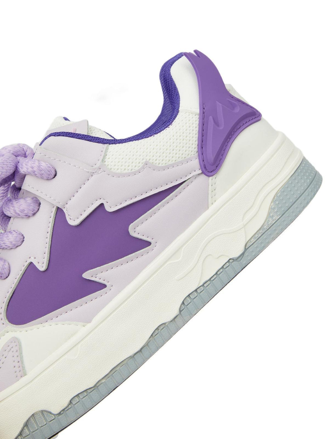 A close-up of the TALISHKO retro board shoes, highlighting the purple side design detail.