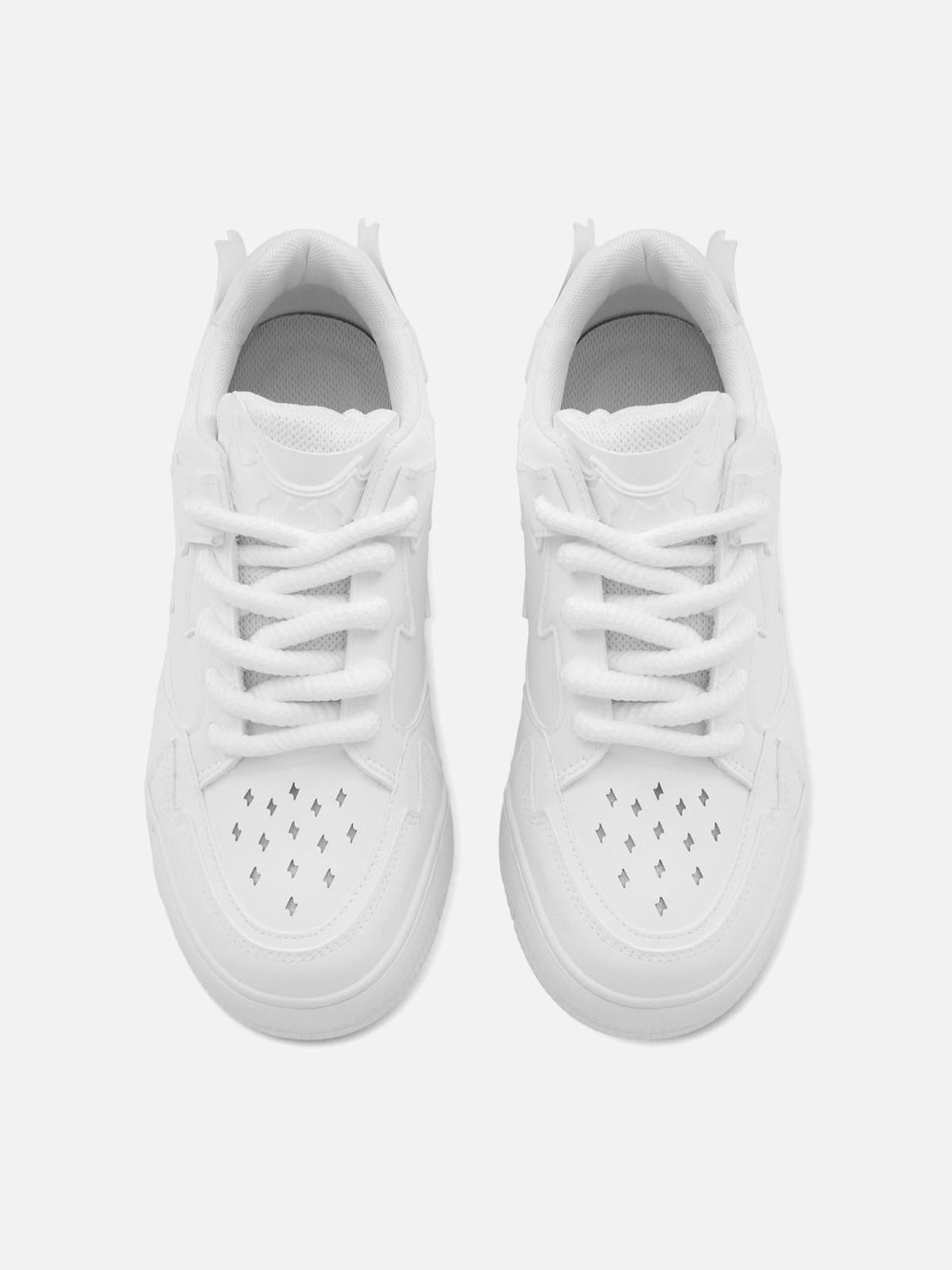 Top view of white TALISHKO retro board shoes, highlighting unique perforated details.