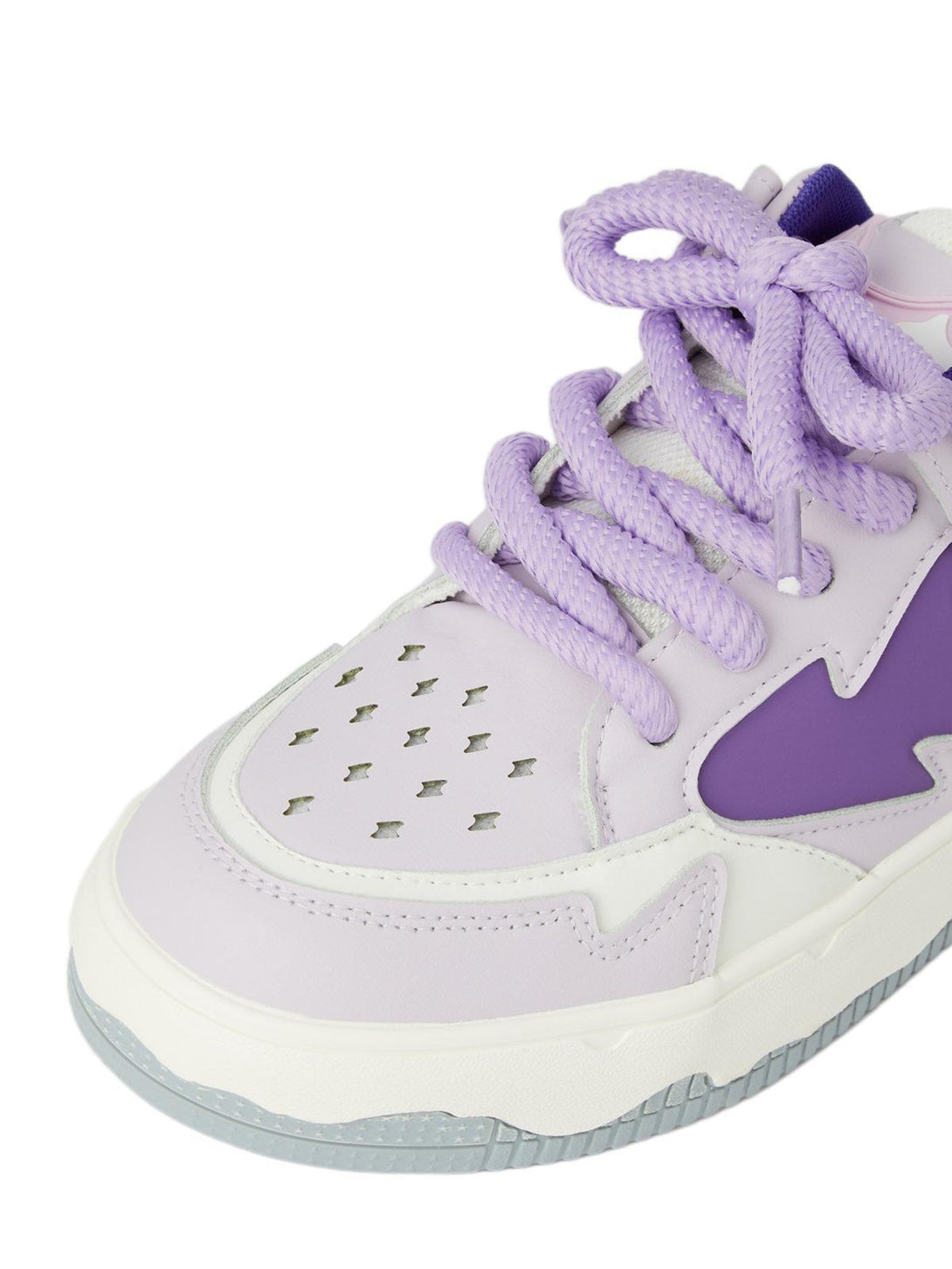 A detailed look at TALISHKO retro board shoes, focusing on purple laces and perforated design.