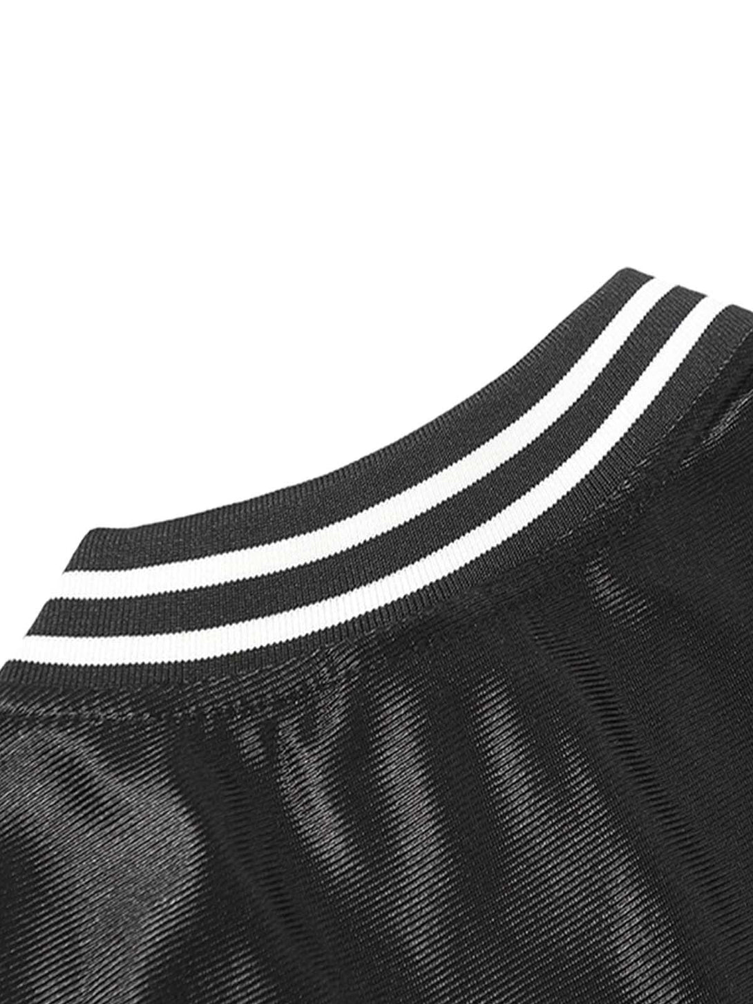 A detailed view of the black jersey's striped collar and shiny texture by TALISHKO.