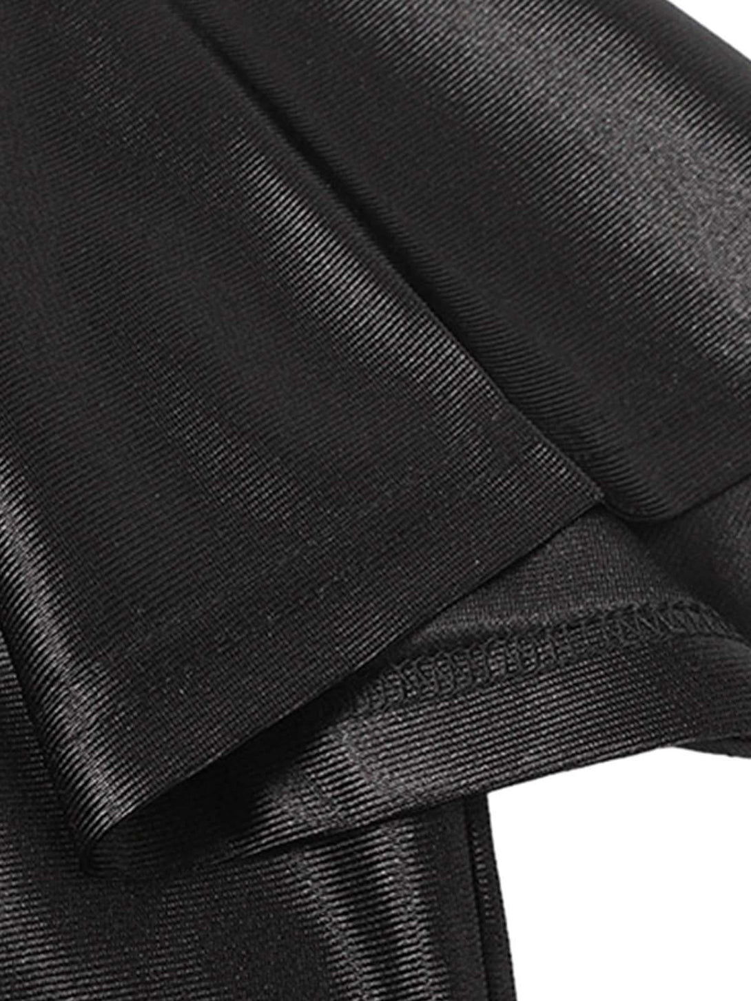 A tight crop highlighting the smooth, shiny texture of a black jersey by TALISHKO.