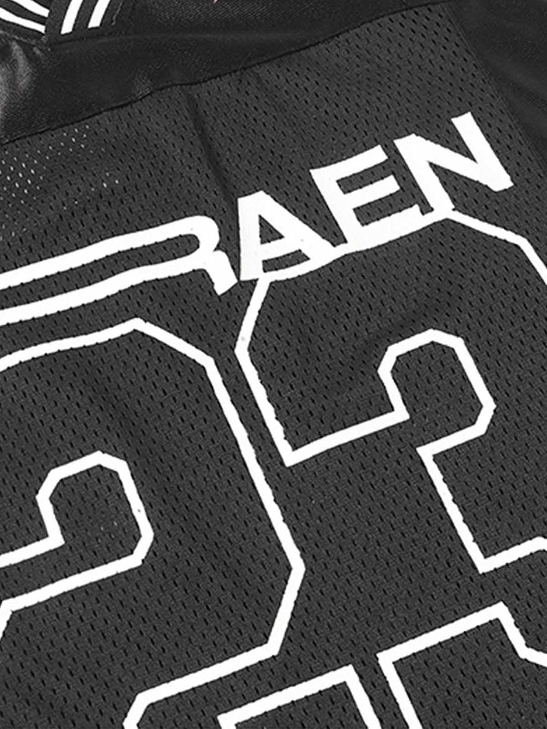 Intricate look at the black jersey's bold white graphics and fabric texture by TALISHKO.