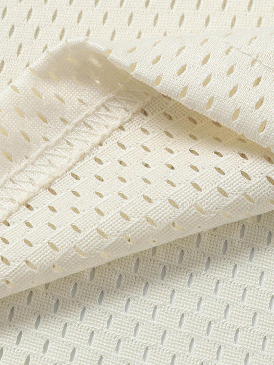 Zoomed-in texture of TALISHKO sports jersey T-shirt, featuring breathable mesh fabric.