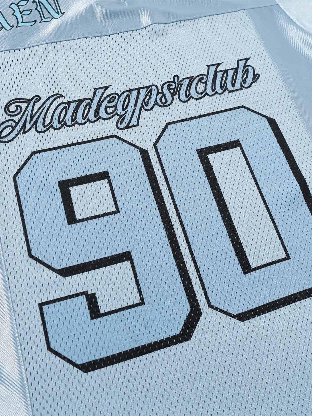 A detailed view of the back of TALISHKO's jersey V-neck T-shirt, showcasing the number 90 design.