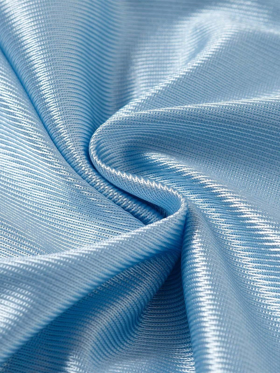 Texture and pattern showcased in TALISHKO's light blue jersey fabric, highlighting its sheen.