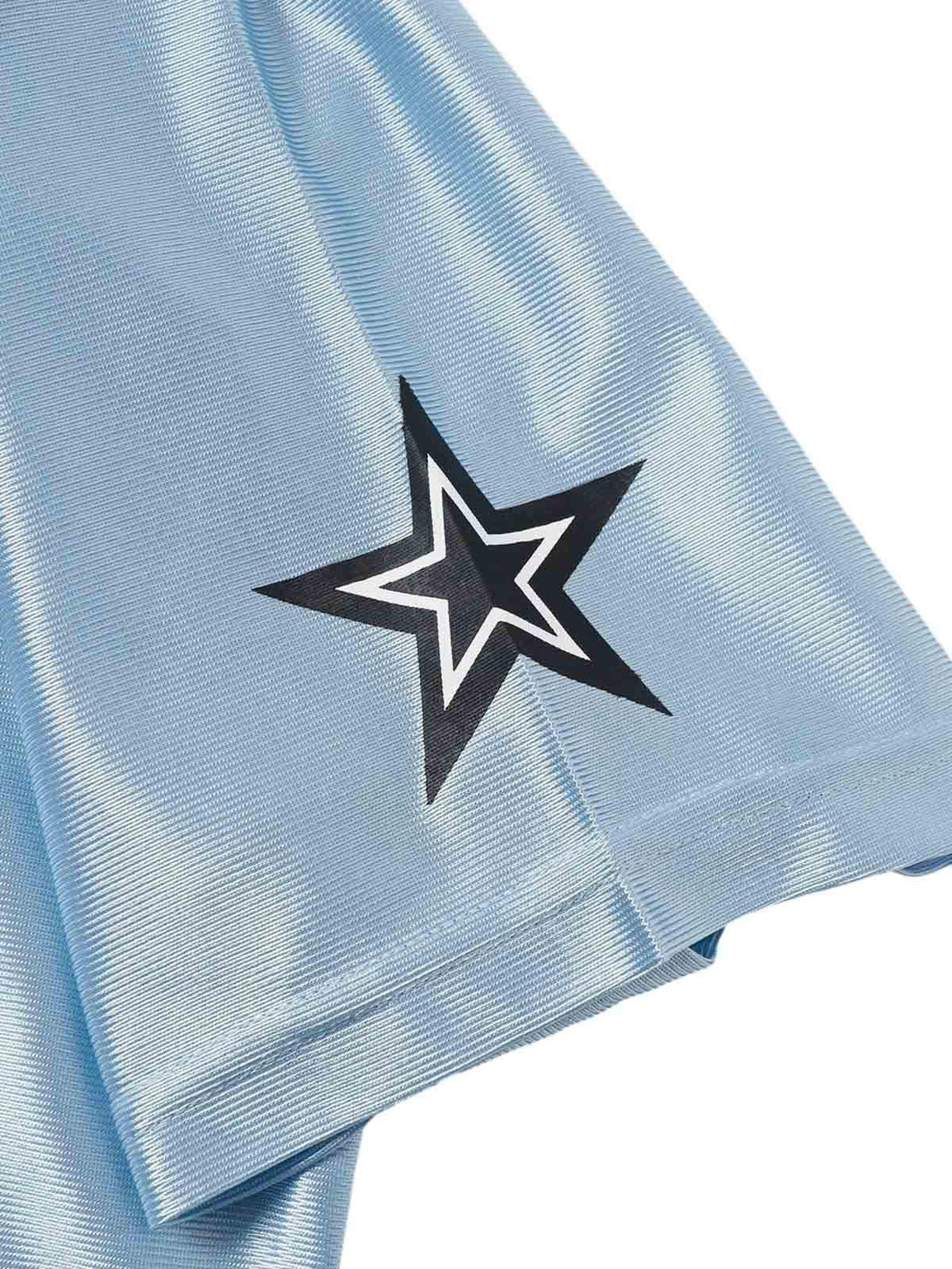 A detailed look at TALISHKO's light blue jersey T-shirt sleeve, featuring a bold star design.